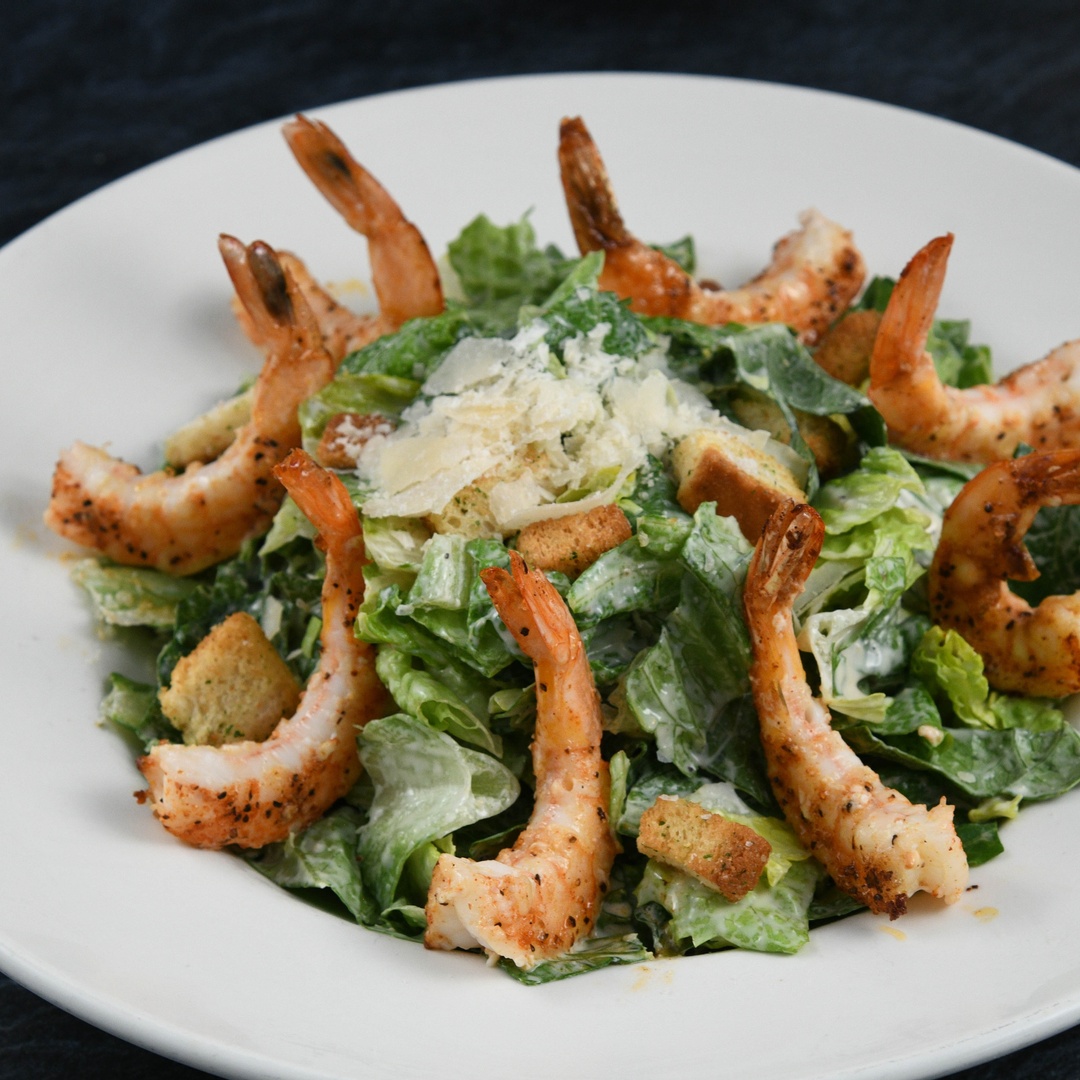 Order Big Islander Caesar Salad With Shrimp food online from Rainforest Cafe store, Las Vegas on bringmethat.com