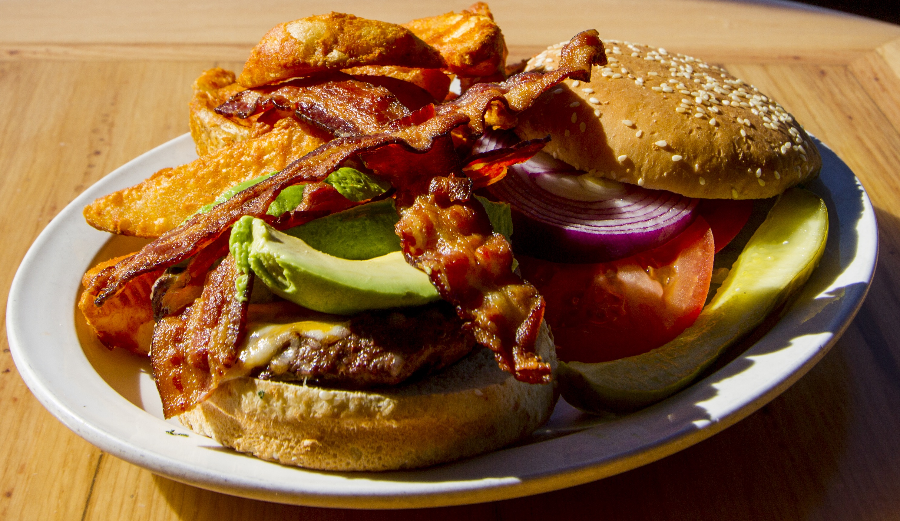 Order Avocado Bacon Chzburger food online from Coyote Grill store, Laguna Beach on bringmethat.com
