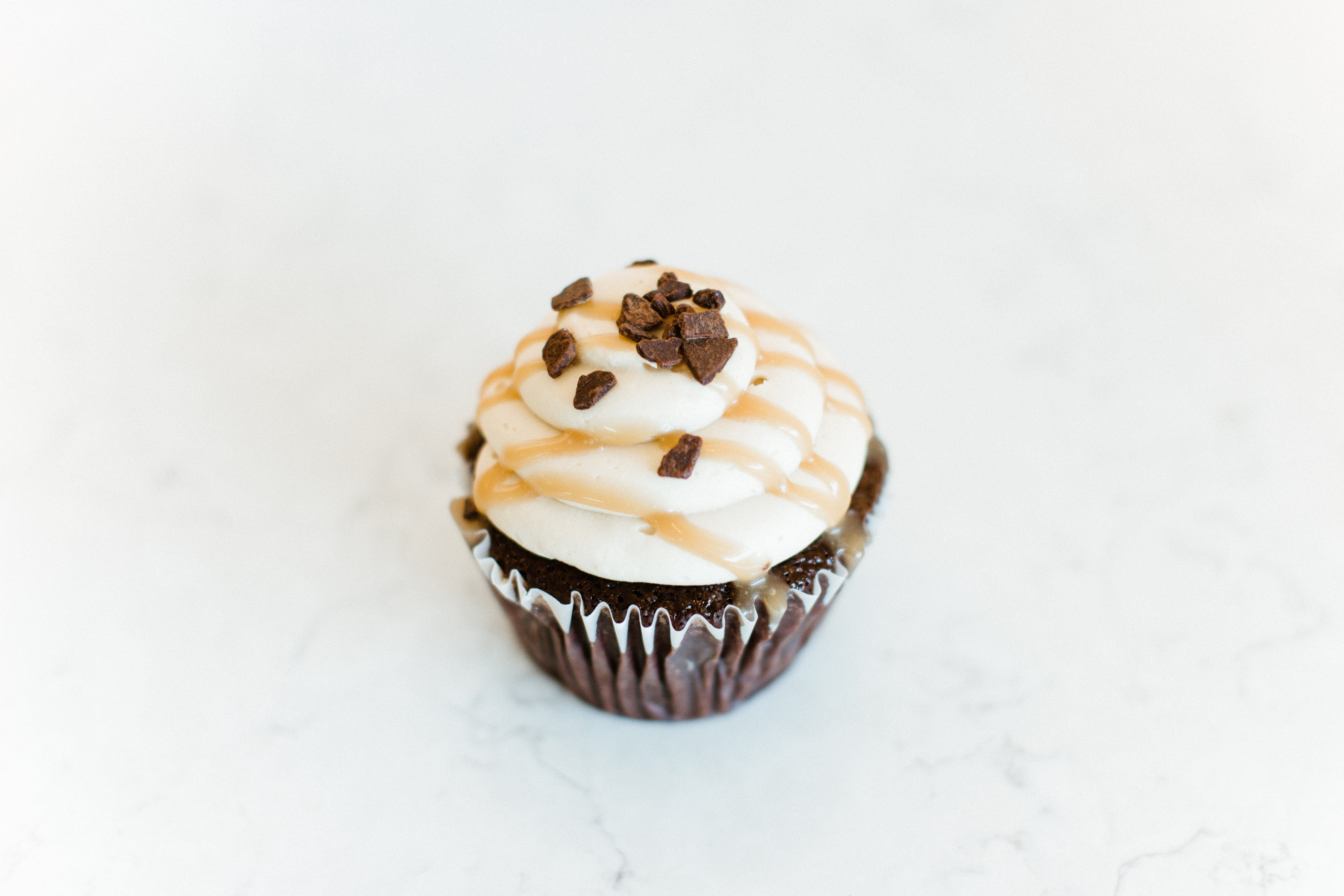 Order Chocolate Salted Caramel Cupcake (GF and V) food online from Tomato Pie Cafe store, Lititz on bringmethat.com