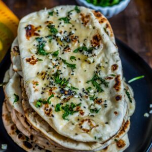 Order Garlic Naan food online from Bollywood Curry store, Los Angeles on bringmethat.com