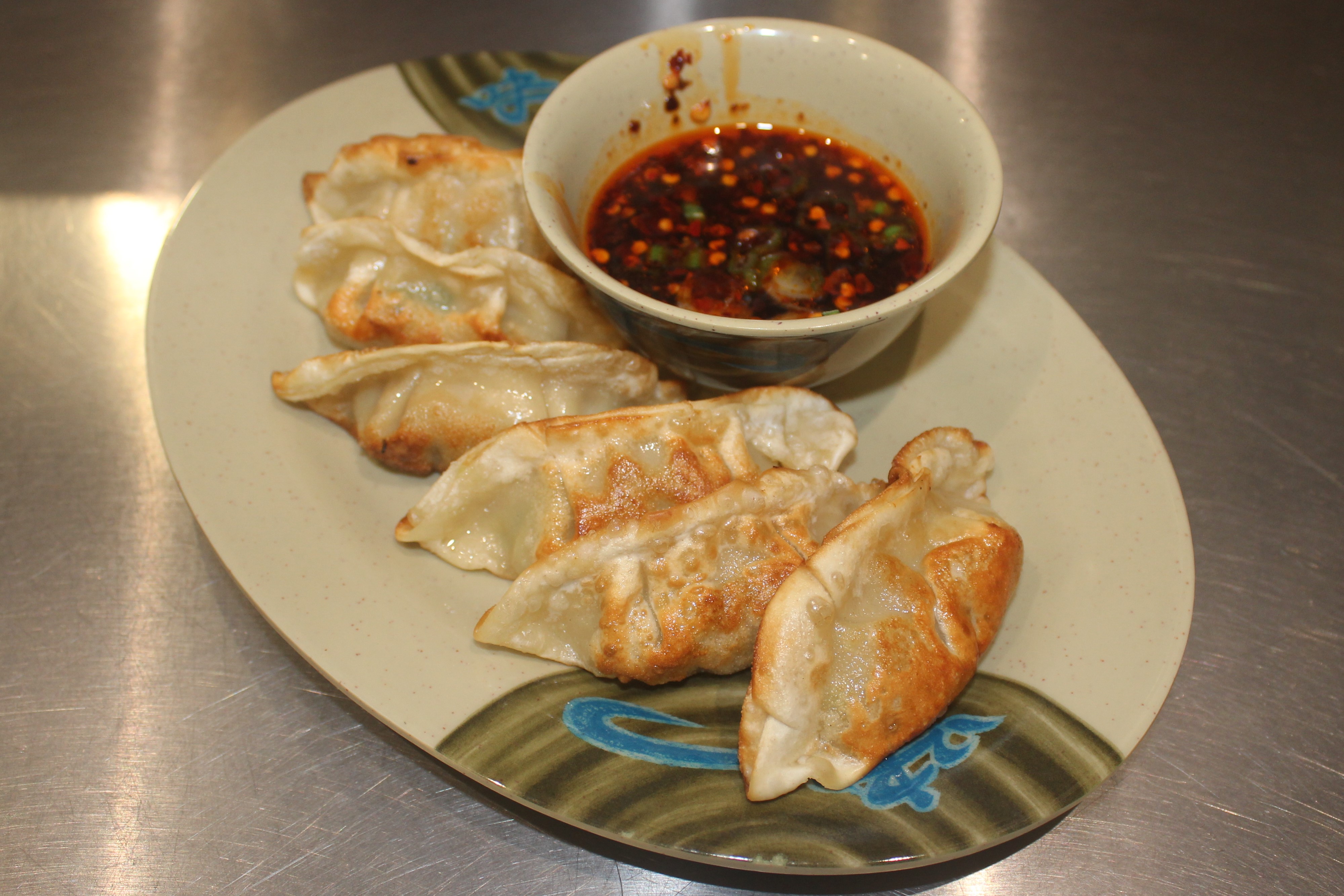 Order Pork Pot Stickers  food online from Nam Noodles And More store, Pasadena on bringmethat.com