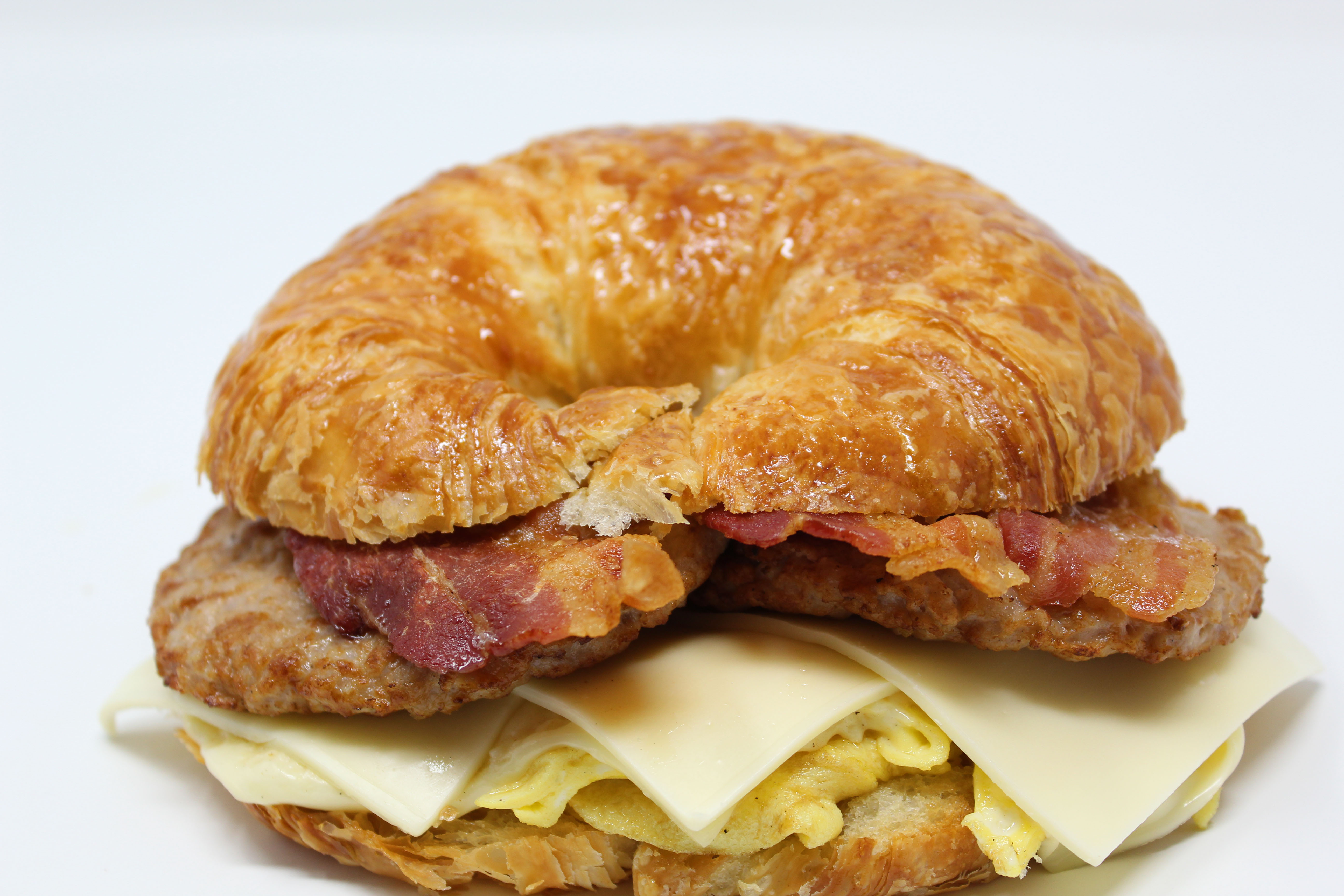 Order 2. Bacon, Sausage, Egg and Cheese Sandwich food online from Cafe Donuts store, West Covina on bringmethat.com