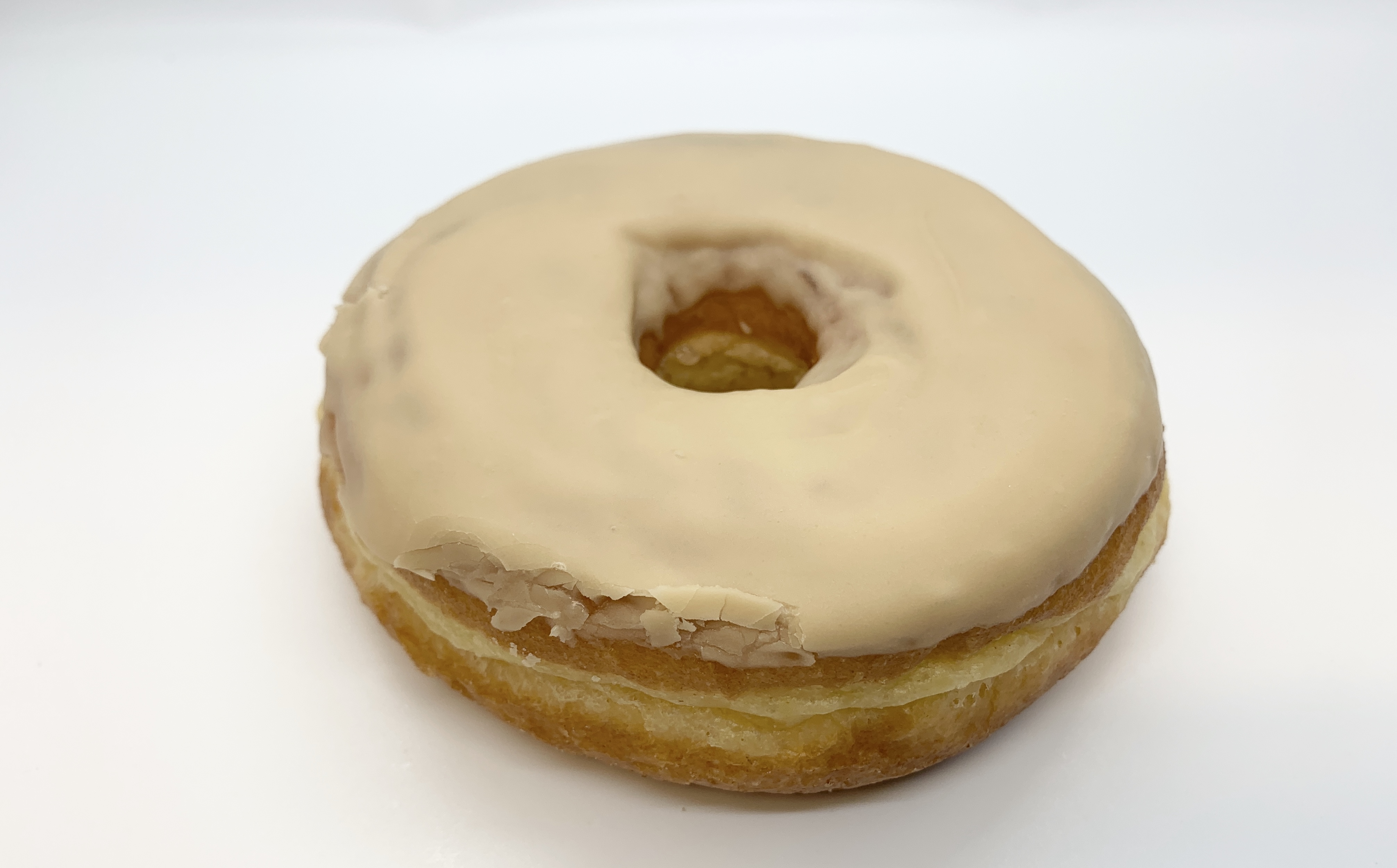 Order Raised Maple Icing Donut food online from Star Donuts store, Medford on bringmethat.com