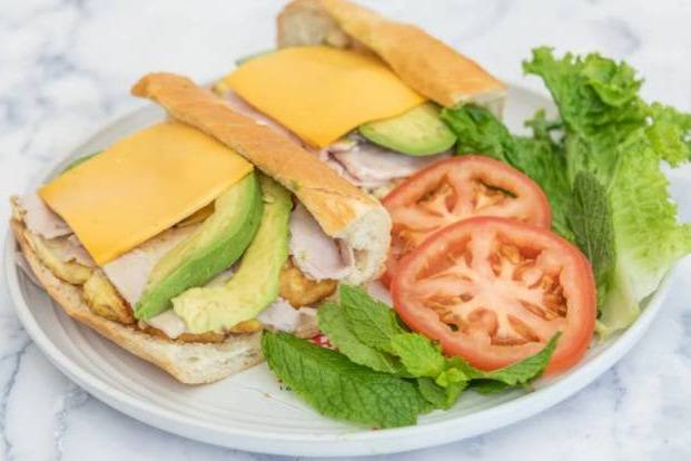 Order 84. Turkey, Avocado, Egg, & Cheese on a Croissant food online from Lee Sandwiches store, San Jose on bringmethat.com