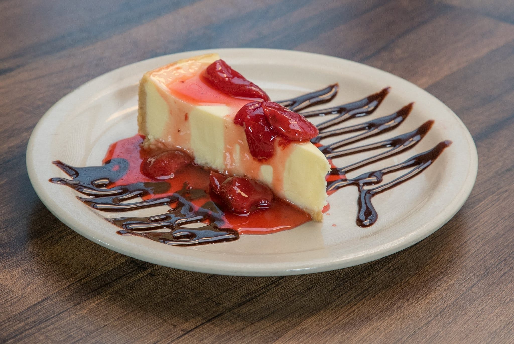 Order NY Style Cheesecake - Half food online from Zio Pizzeria store, Omaha on bringmethat.com