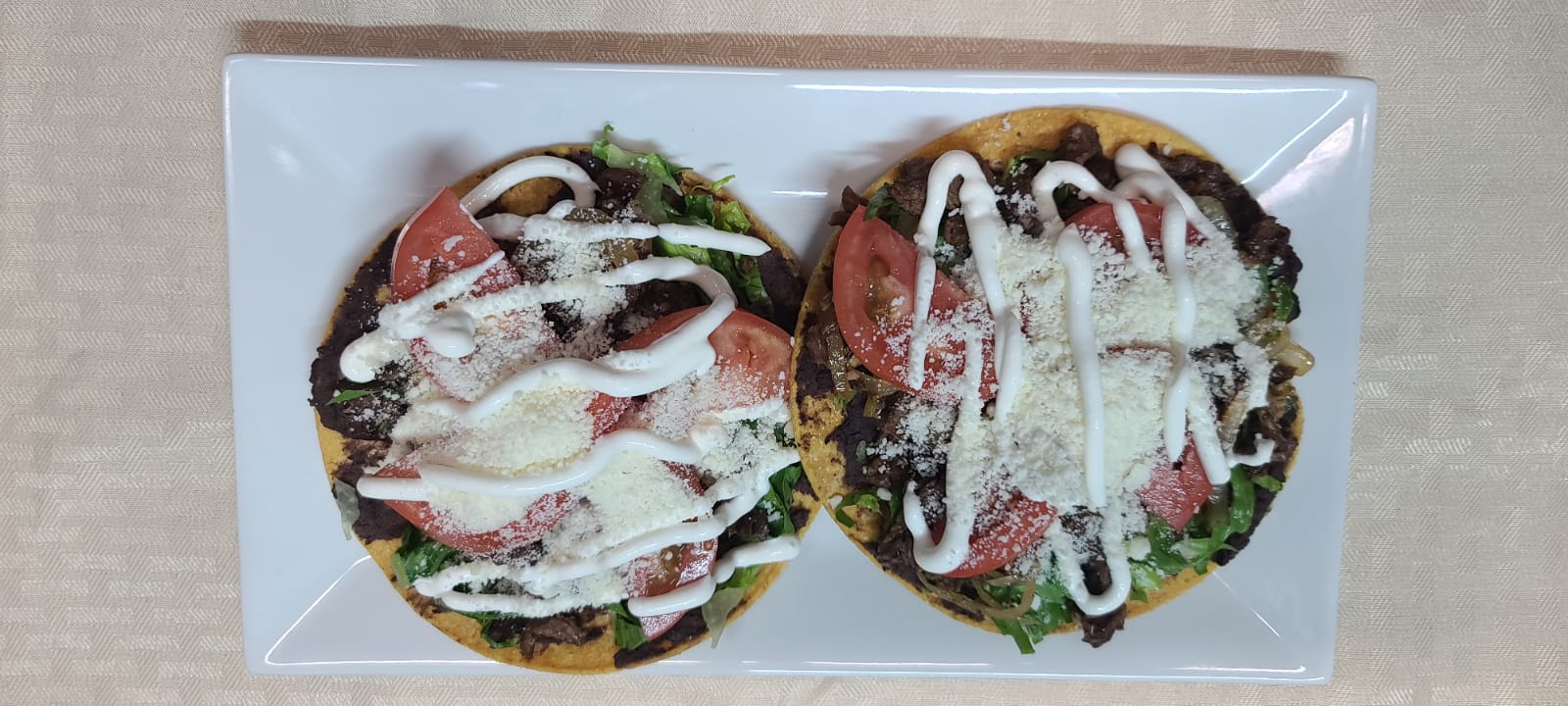 Order tostadas steak (2) food online from Marce Taqueria Express store, Bronx on bringmethat.com