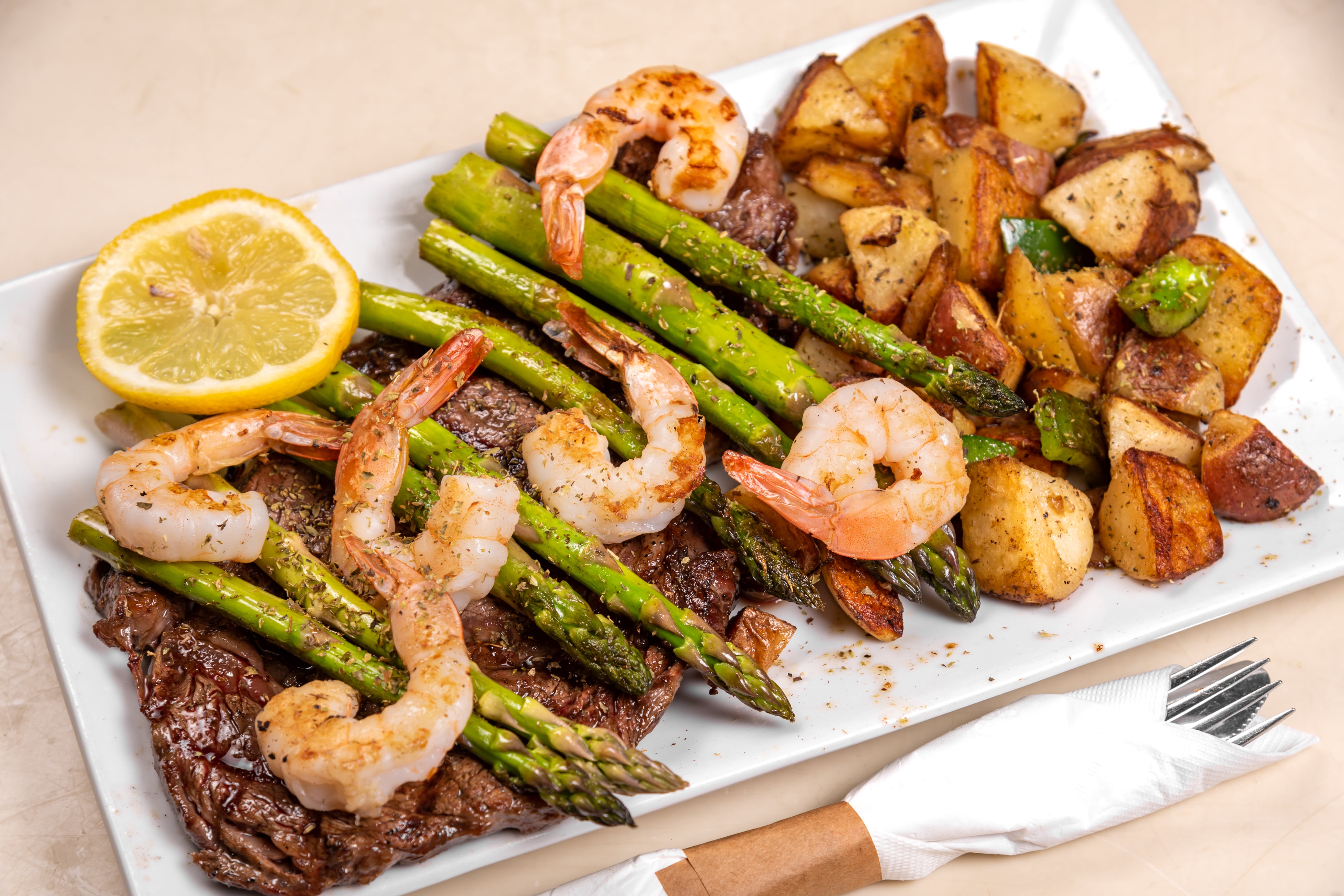 Order Omonia's Surf & Turf Special - Special food online from Omonia Cafe store, Astoria on bringmethat.com