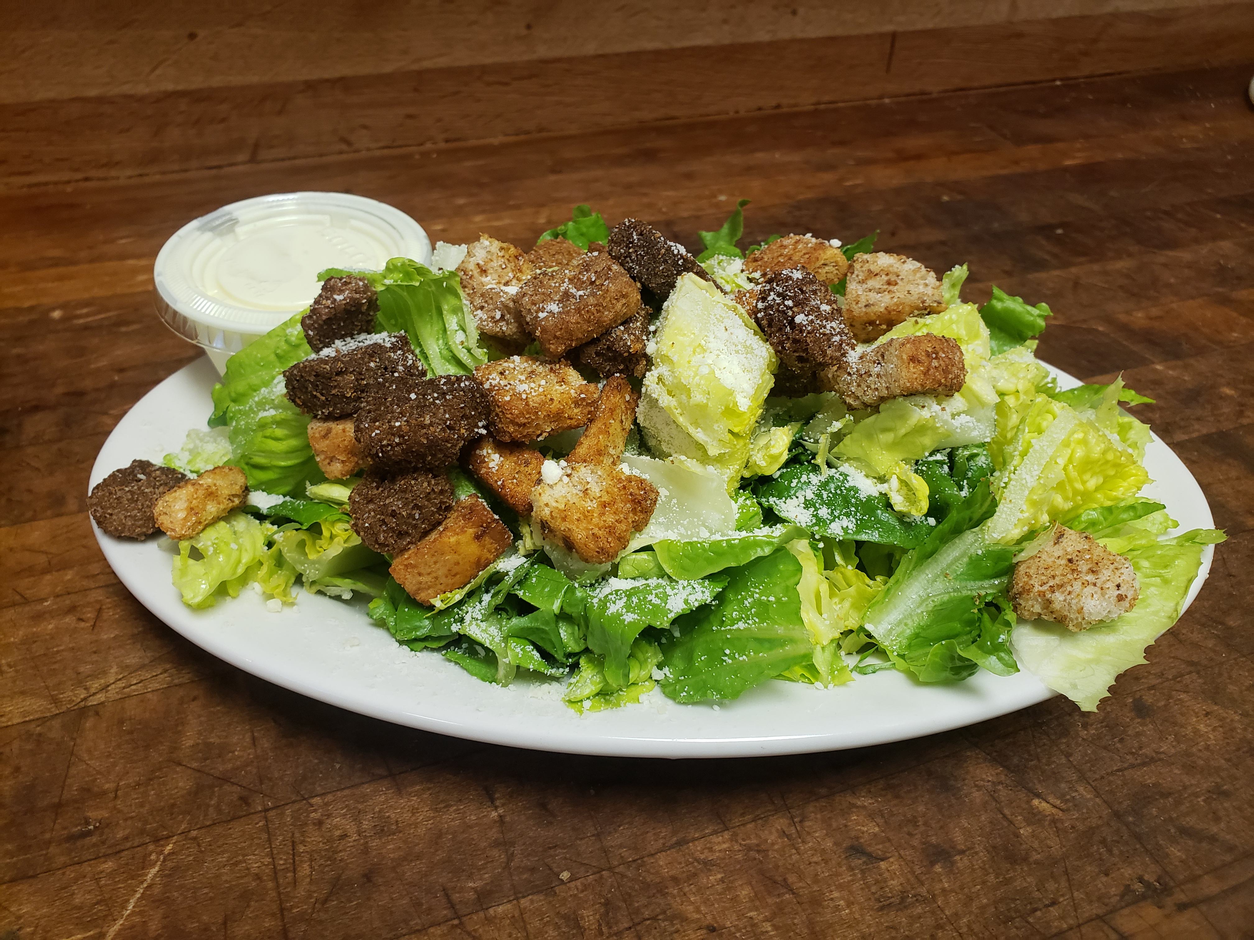 Order Caesar Salad food online from Minervas Pizza store, Providence on bringmethat.com