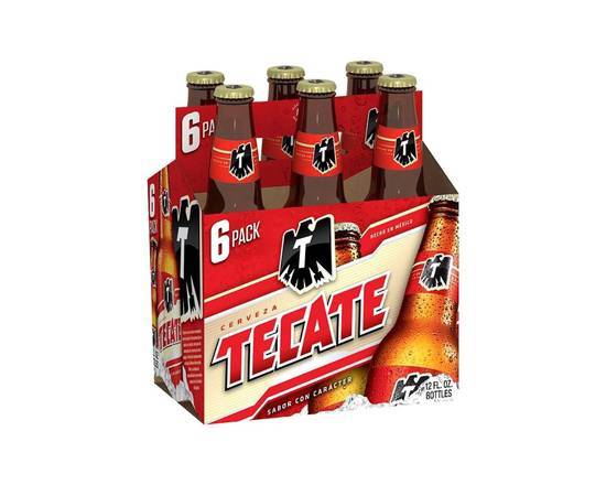 Order Tecate Mexican Beer 12 cans | 4% abv food online from Pink Dot store, Lemon Grove on bringmethat.com