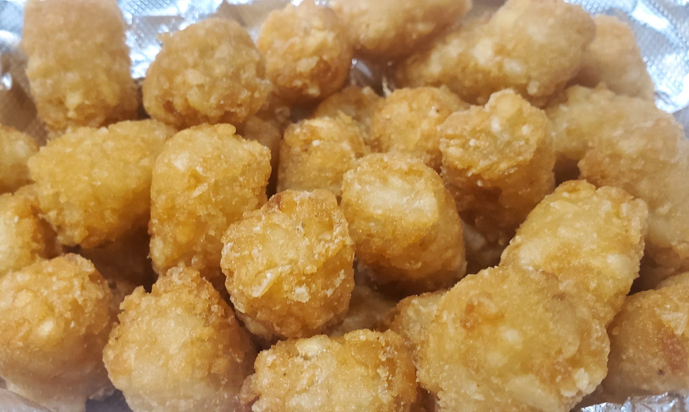 Order Basket of Tots food online from Knuckles Knockout Grill store, Rochester on bringmethat.com