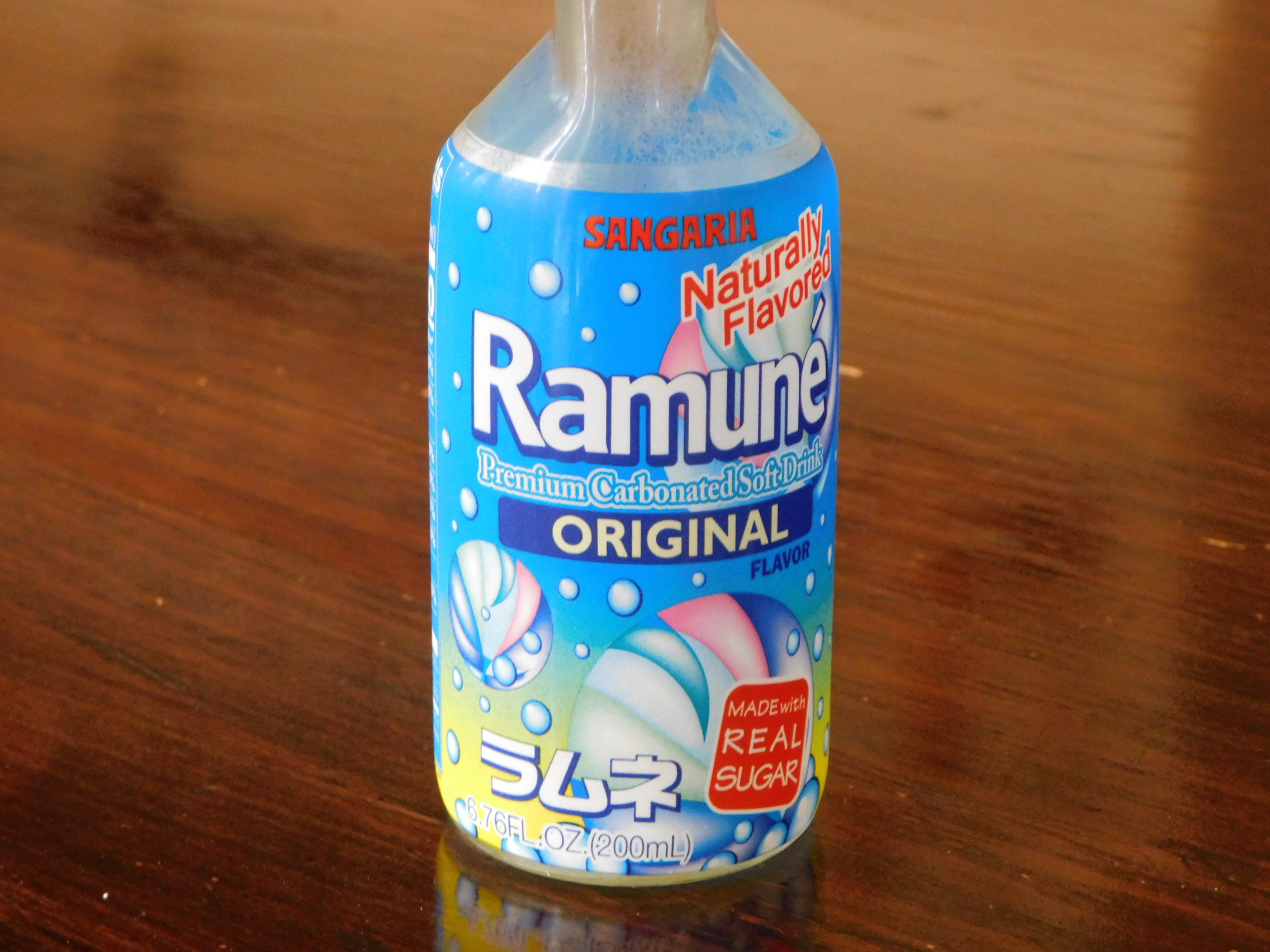 Order Ramune (Bottle) Japanese Sparkling Drink food online from Moto Azabu Sushi Bar & Grill store, Marina Del Rey on bringmethat.com
