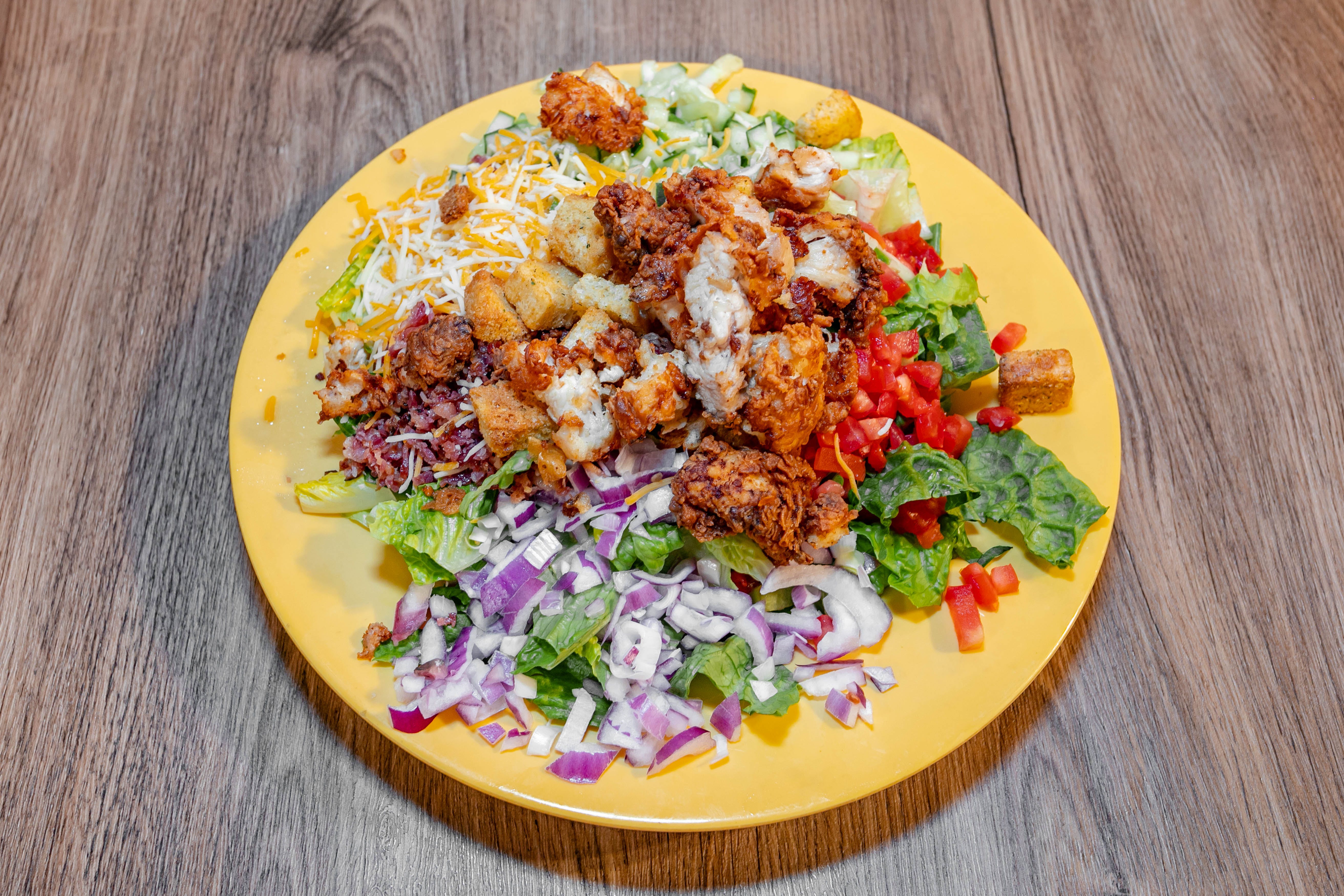 Order Crispy Chicken Salad - Large food online from Sopranos Grill store, Braselton on bringmethat.com