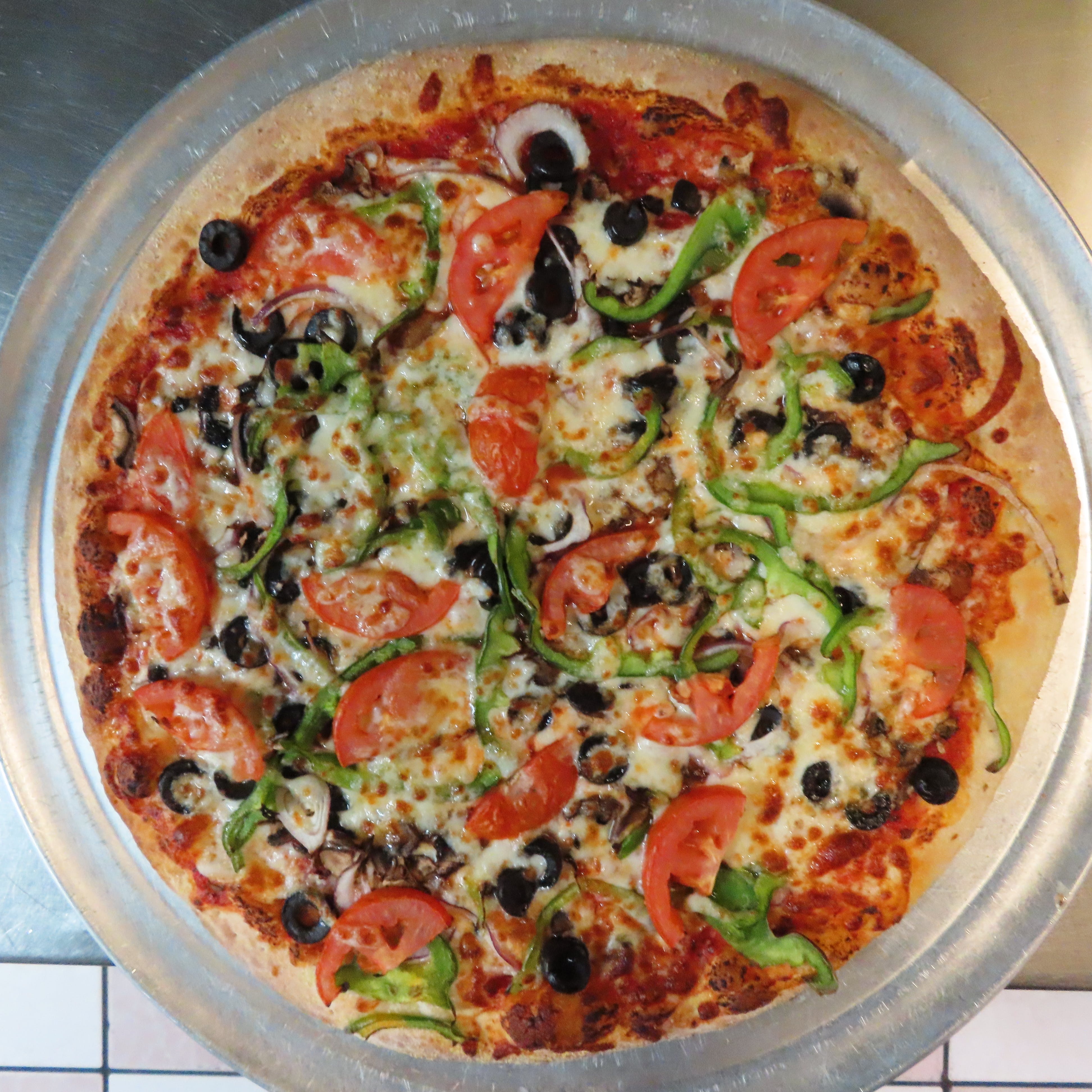 Order Veggie Combo Pizza - Medium 12" food online from The Pizza Guy store, Dallas on bringmethat.com