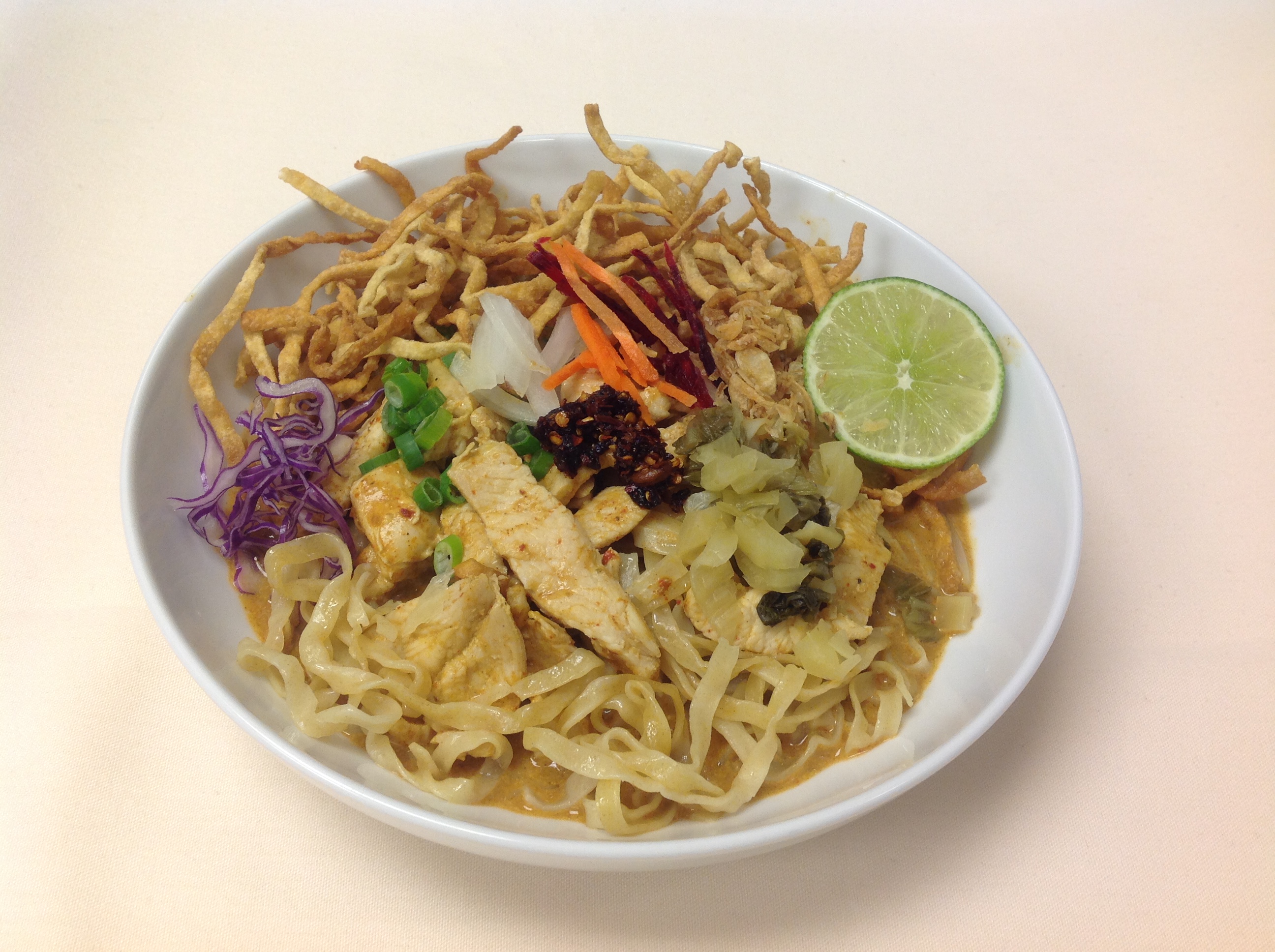 Order 72. Khao Soy Noodle food online from Nine Thai Cuisine store, Chicago on bringmethat.com