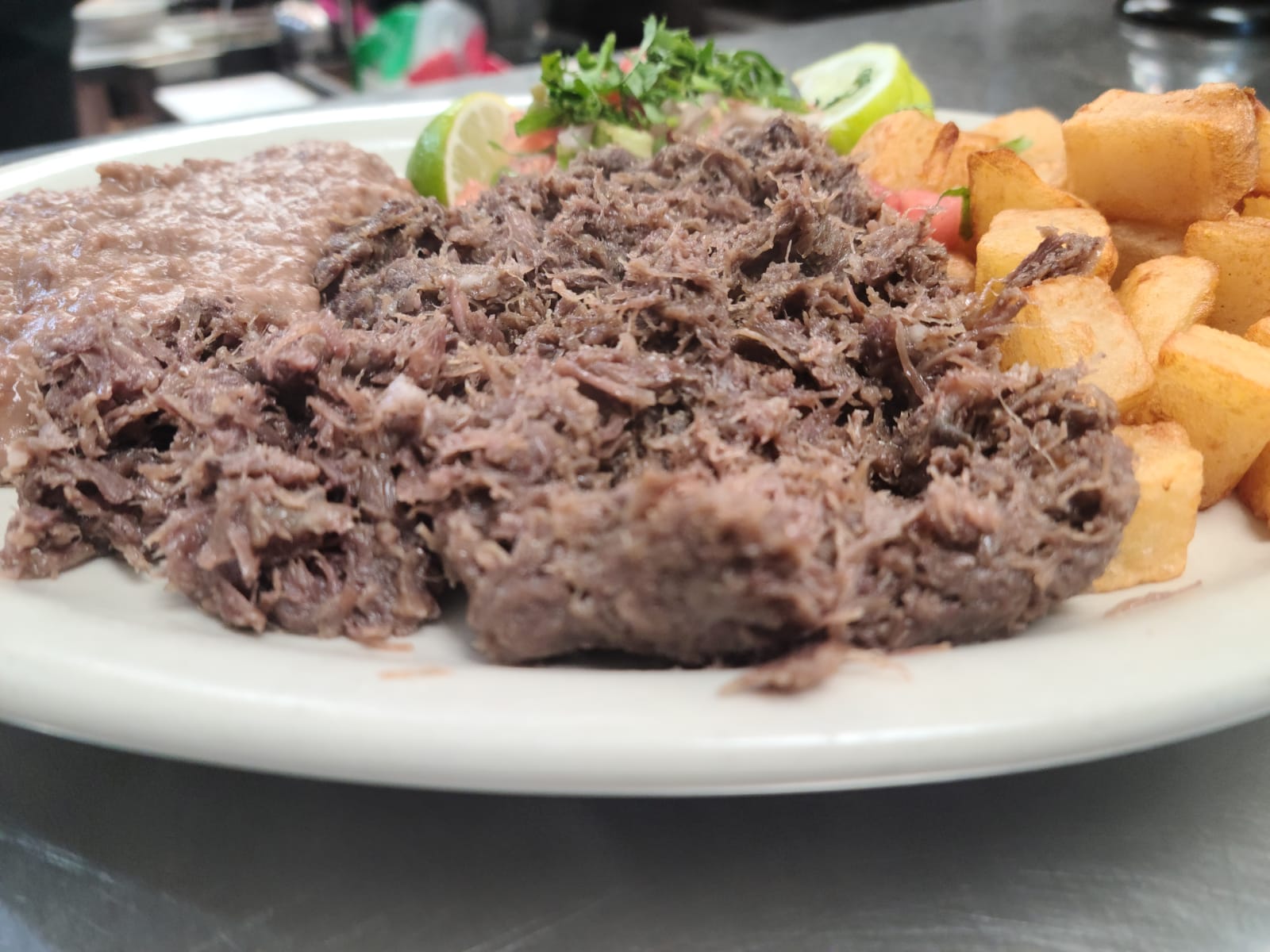 Order Barbacoa Plate food online from Los Arcos Mexican Grill store, San Antonio on bringmethat.com