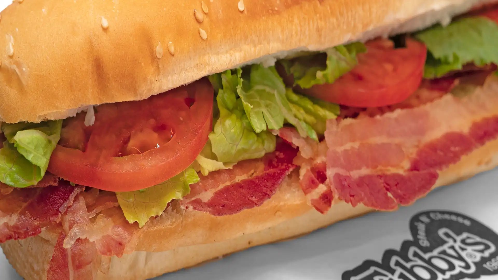 Order BLT Sub - Small food online from Tubby's Grilled Submarines store, Westland on bringmethat.com
