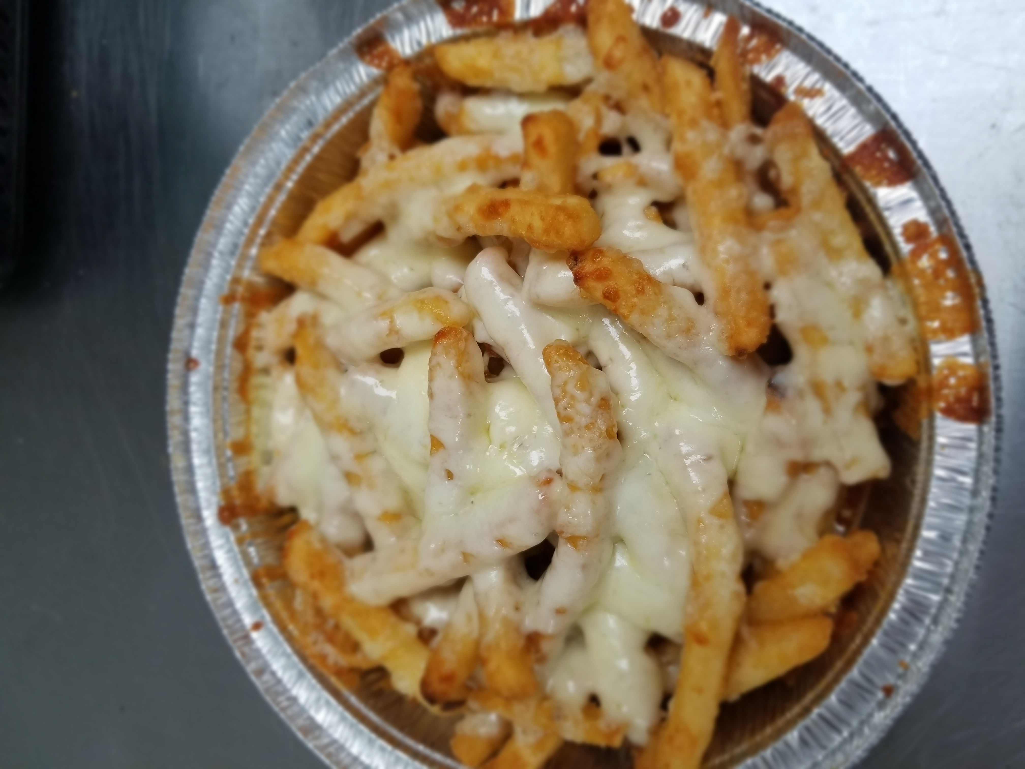 Order French Fries with Cheese food online from Panaro's Pizzeria store, Bridgeport on bringmethat.com