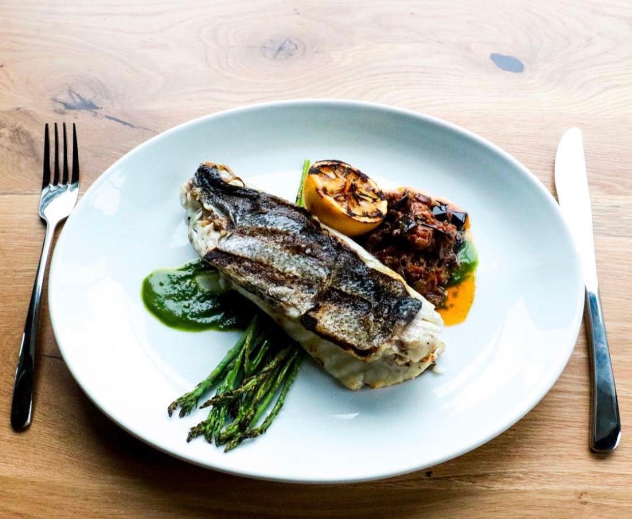Order Grilled Branzino - Entree food online from Lucco Cucina & Bar store, Florham Park on bringmethat.com
