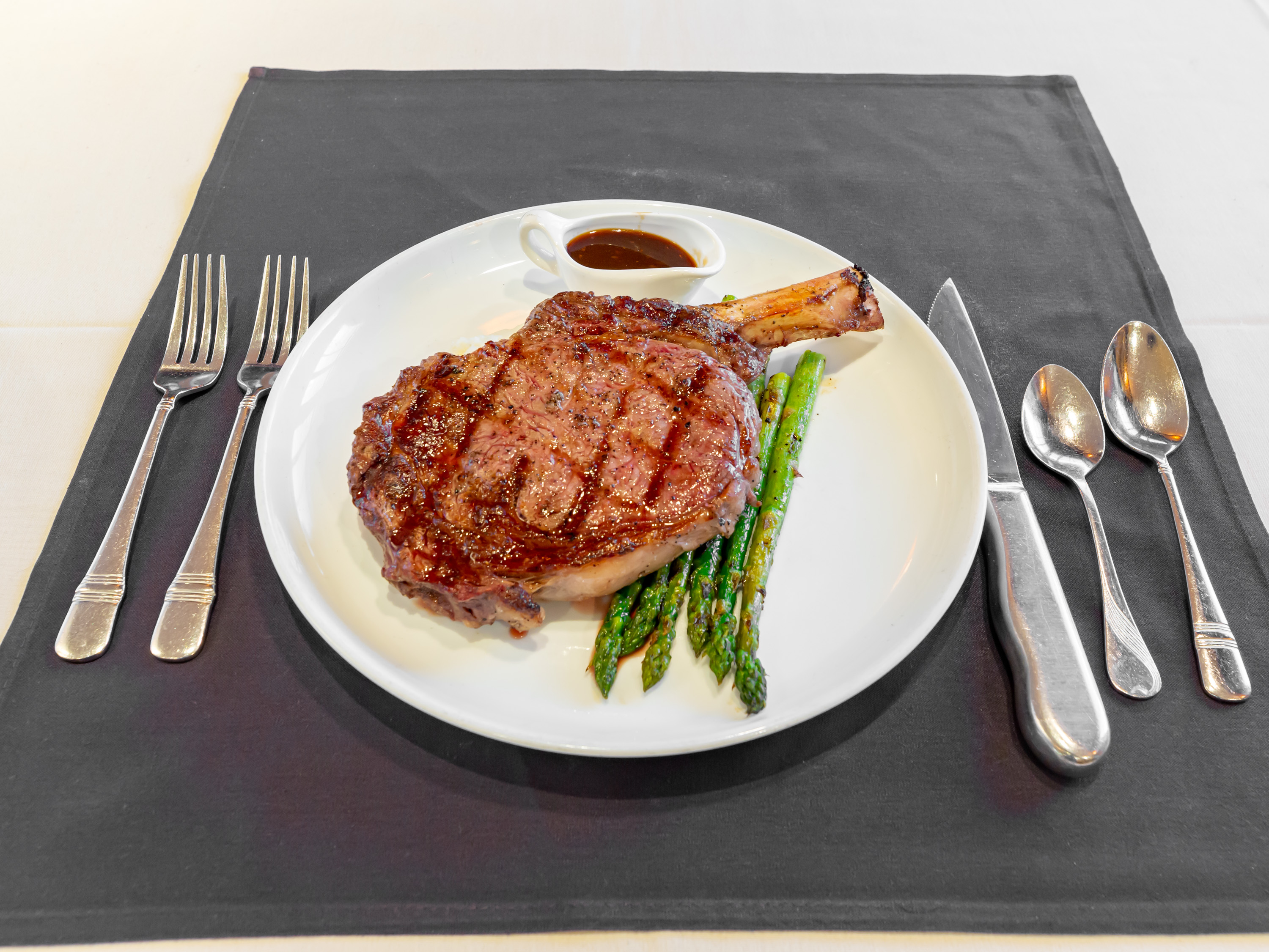 Order  20 oz. Dry Aged Bone in Rib-Eye food online from Parkers Restaurant And Bar store, Downers Grove on bringmethat.com