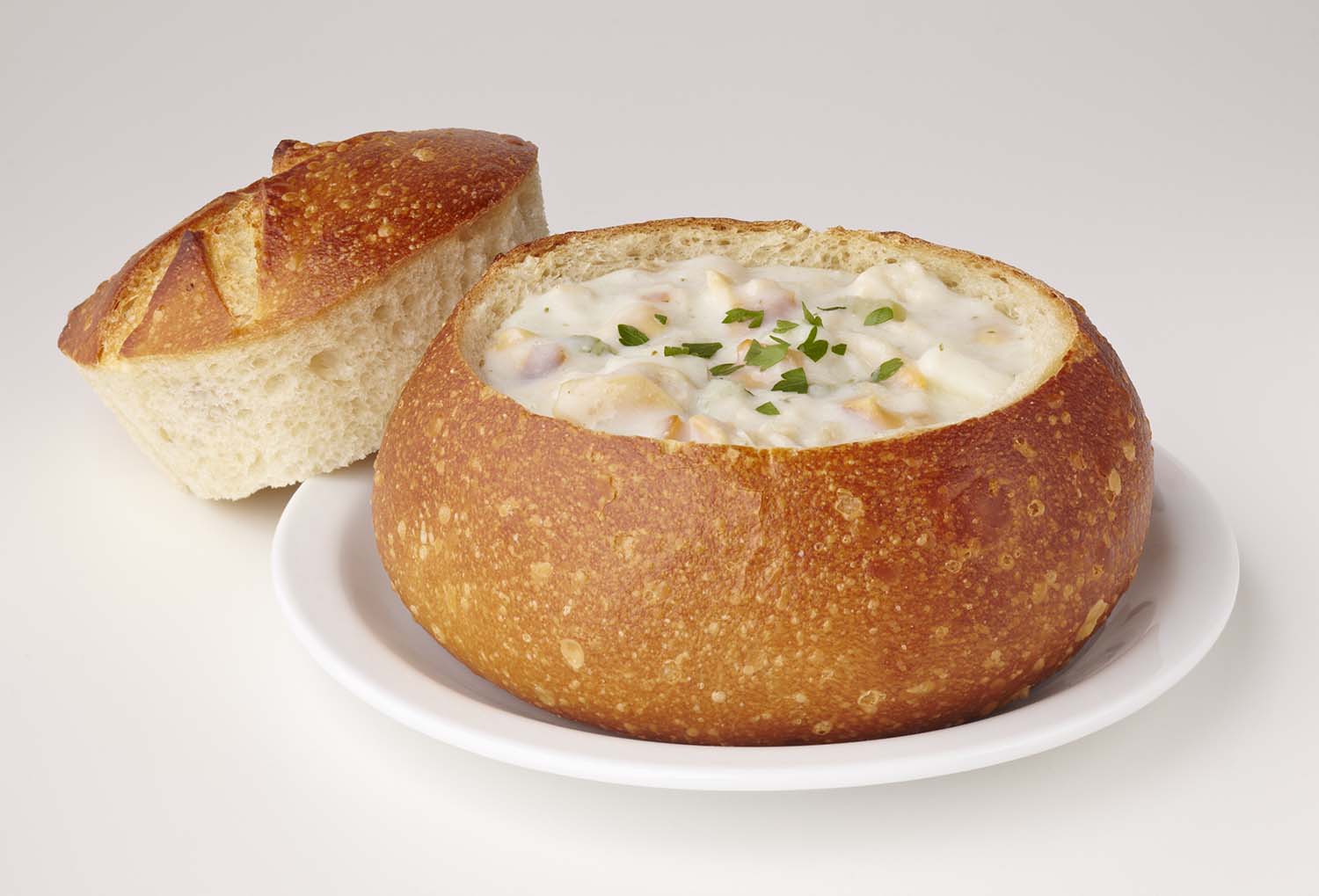 Order Clam Chowder in a bread bowl  food online from Pupusas La Familiar store, Las Vegas on bringmethat.com