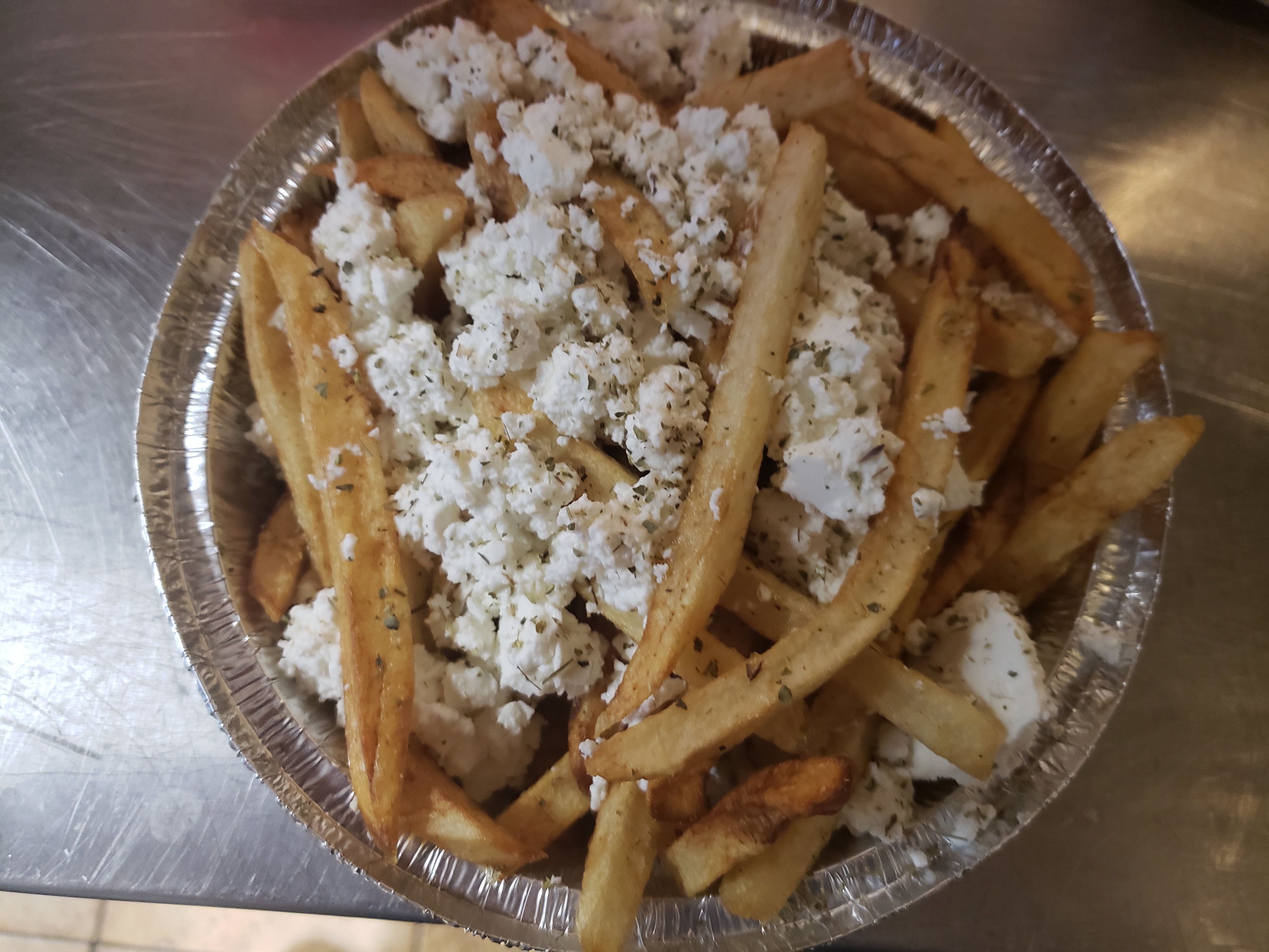 Order Greek French Fries with Feta and Oregano food online from Georges Souvlaki Of Astoria & More store, Brooklyn on bringmethat.com