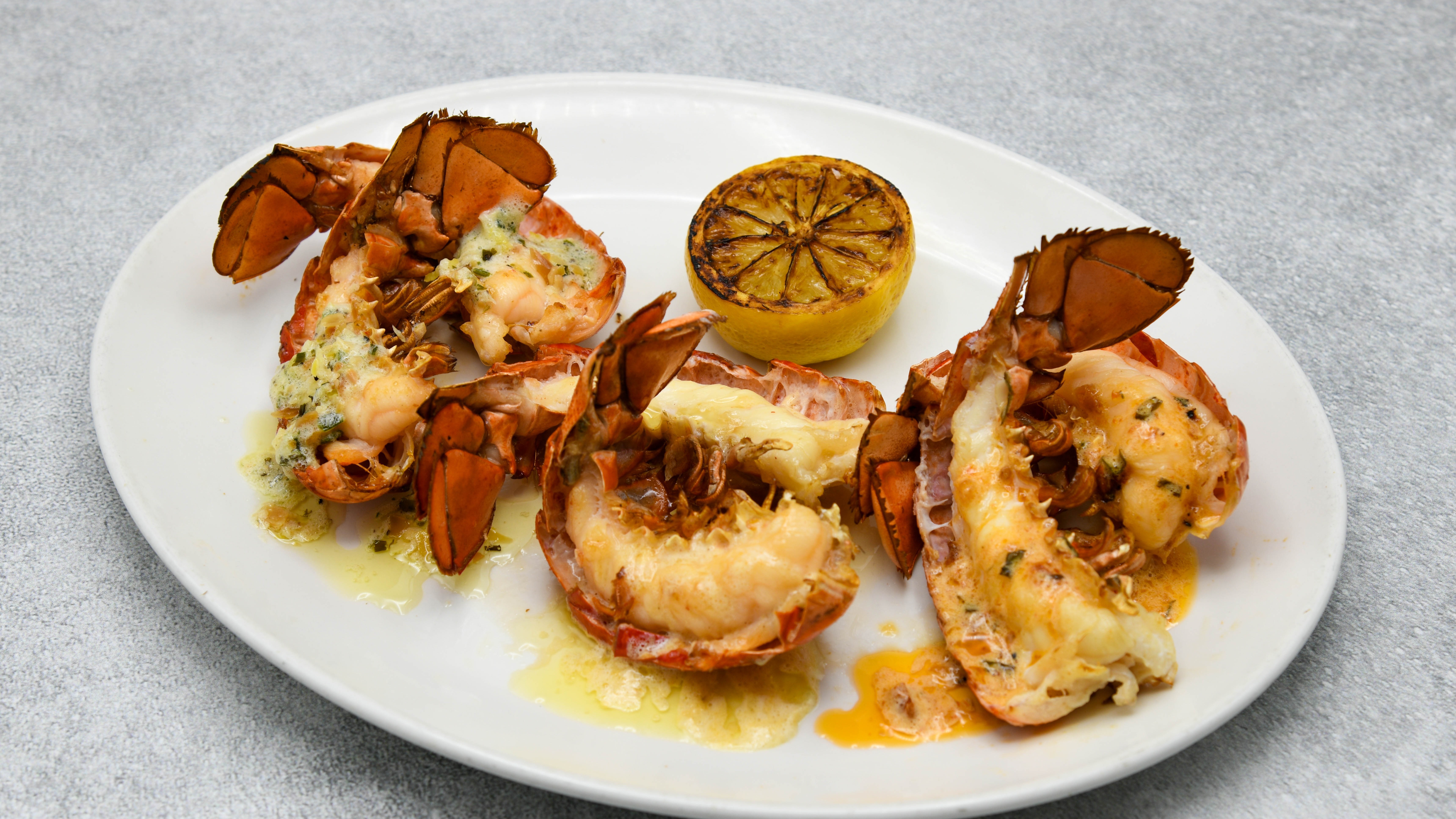 Order Petite Lobster Tail Trio food online from Del Frisco's store, Houston on bringmethat.com