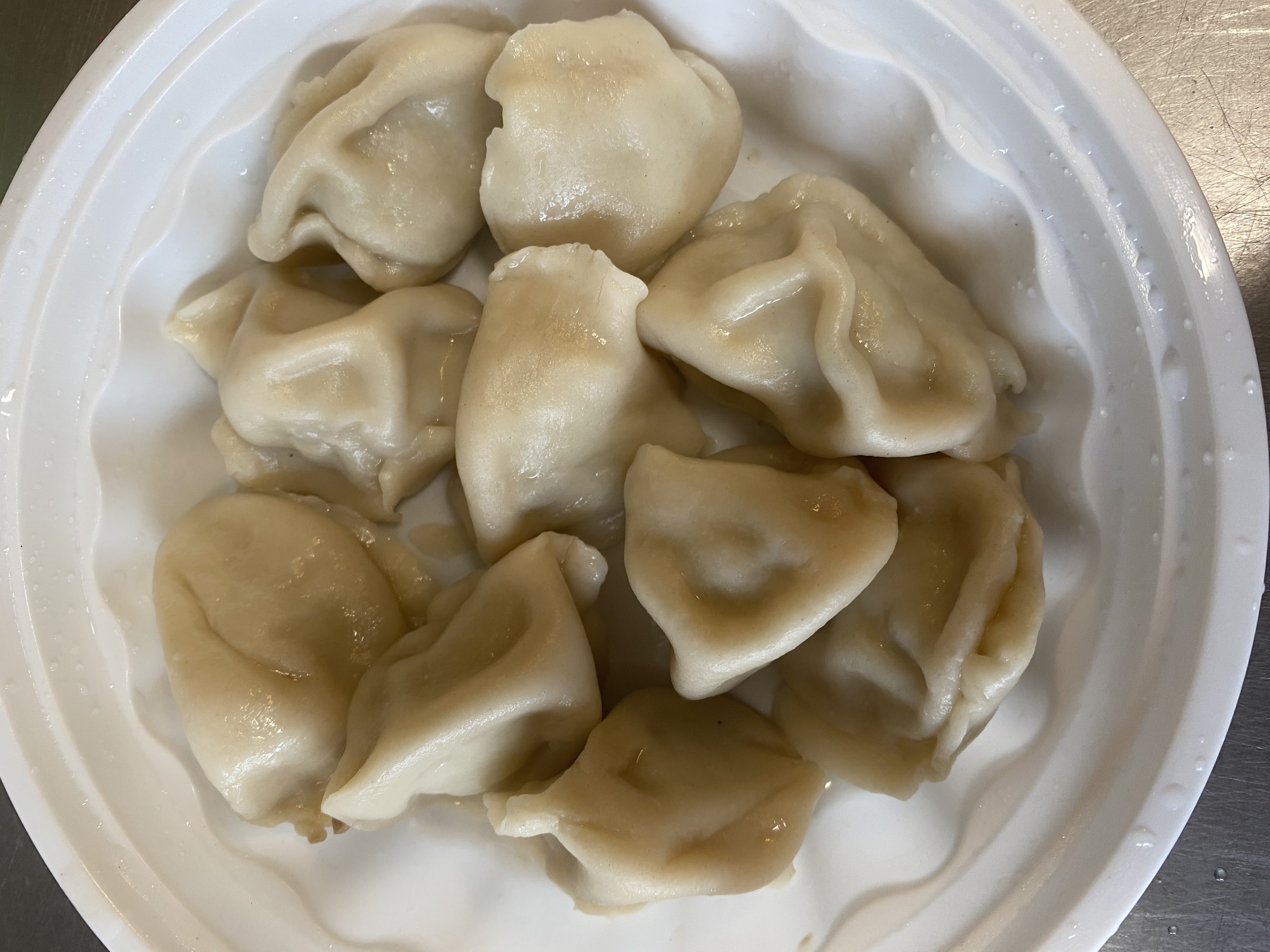 Order 17. Steamed Dumplings (10) food online from New China Inn store, Pittsburgh on bringmethat.com