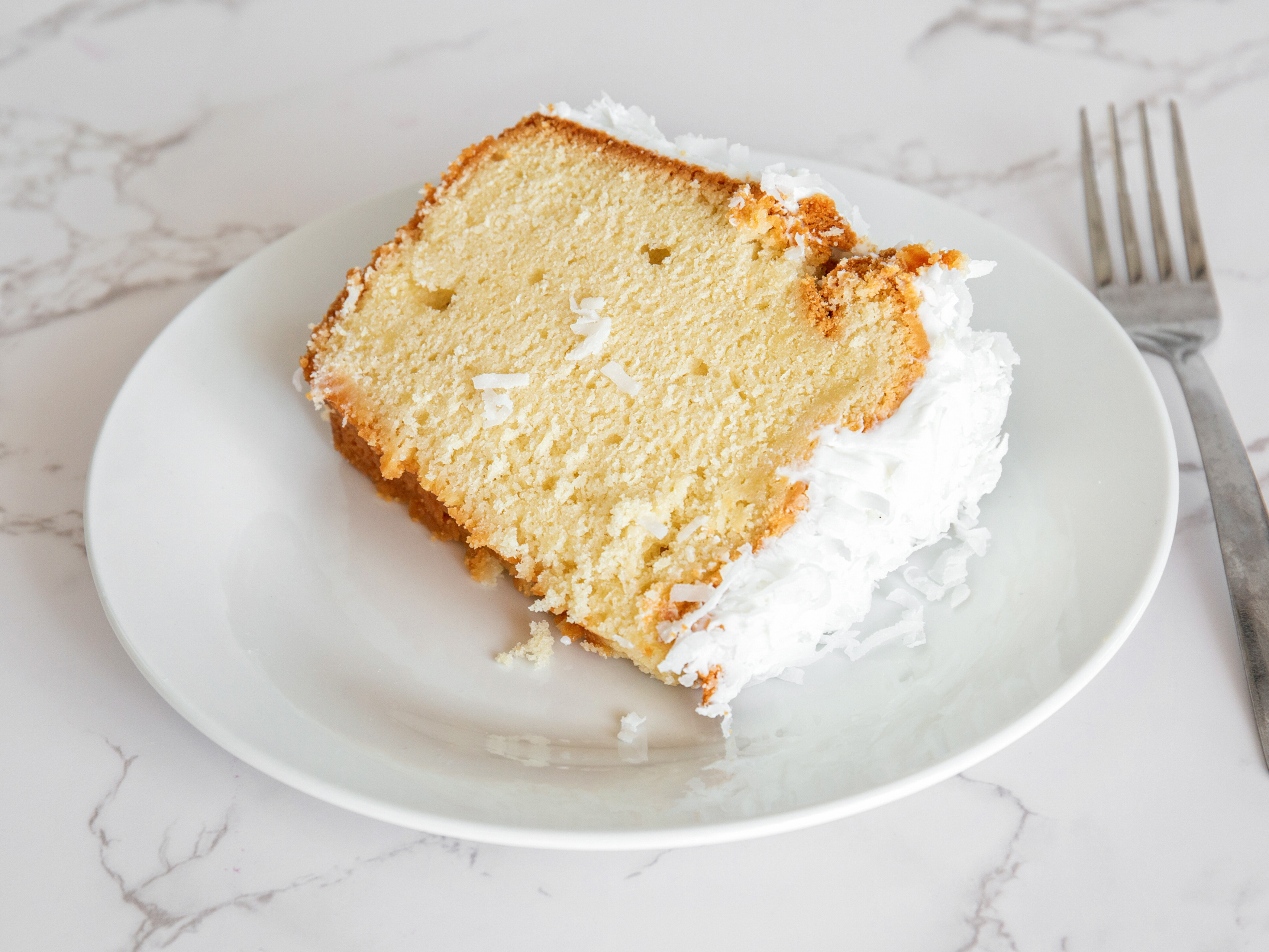 Order Coconut Pound Cake Slice food online from Aunt Berta Kitchen Too store, Lindenwold on bringmethat.com