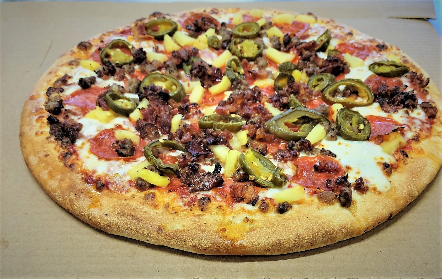 Order Pizza FUEGO- LARGE 14" (8 slices) food online from Pizza Fuego store, San Bernardino on bringmethat.com