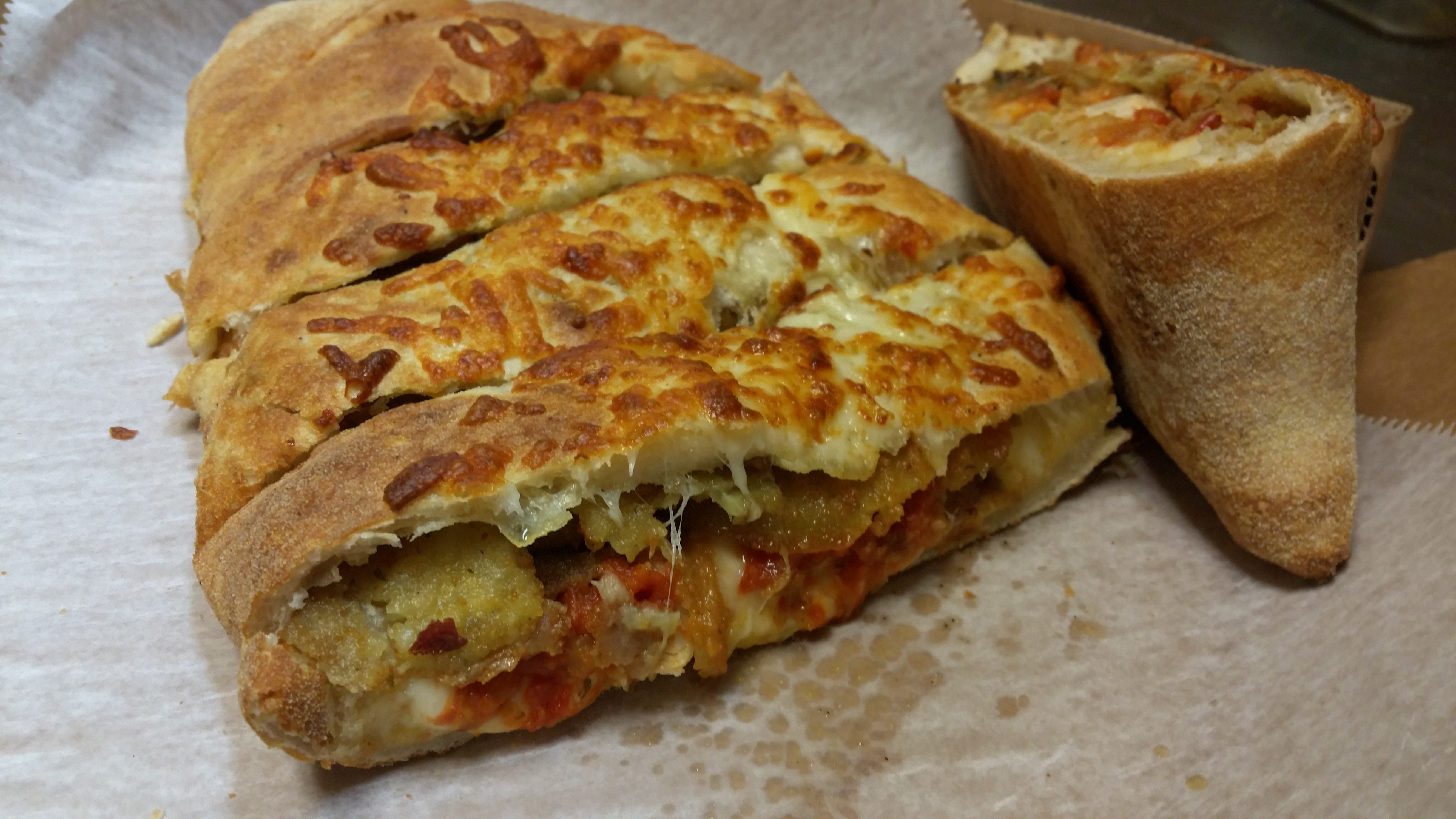 Order Eggplant Parm Calzone food online from Gregory House Of Pizza store, Belmont on bringmethat.com