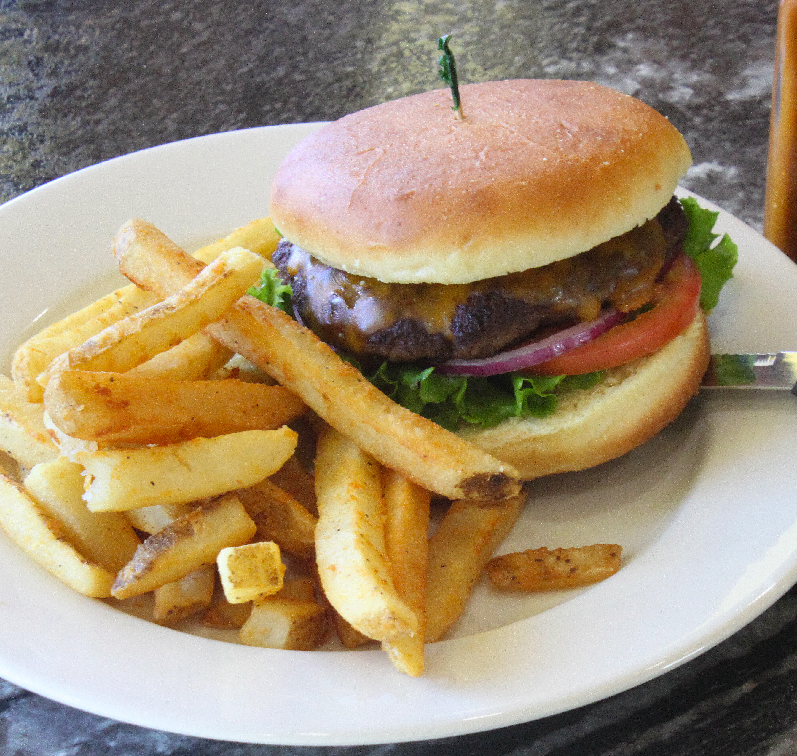 Order Deluxe 1/2 lb. Cheese Burger food online from Quinn Restaurant & Lounge store, Boise on bringmethat.com