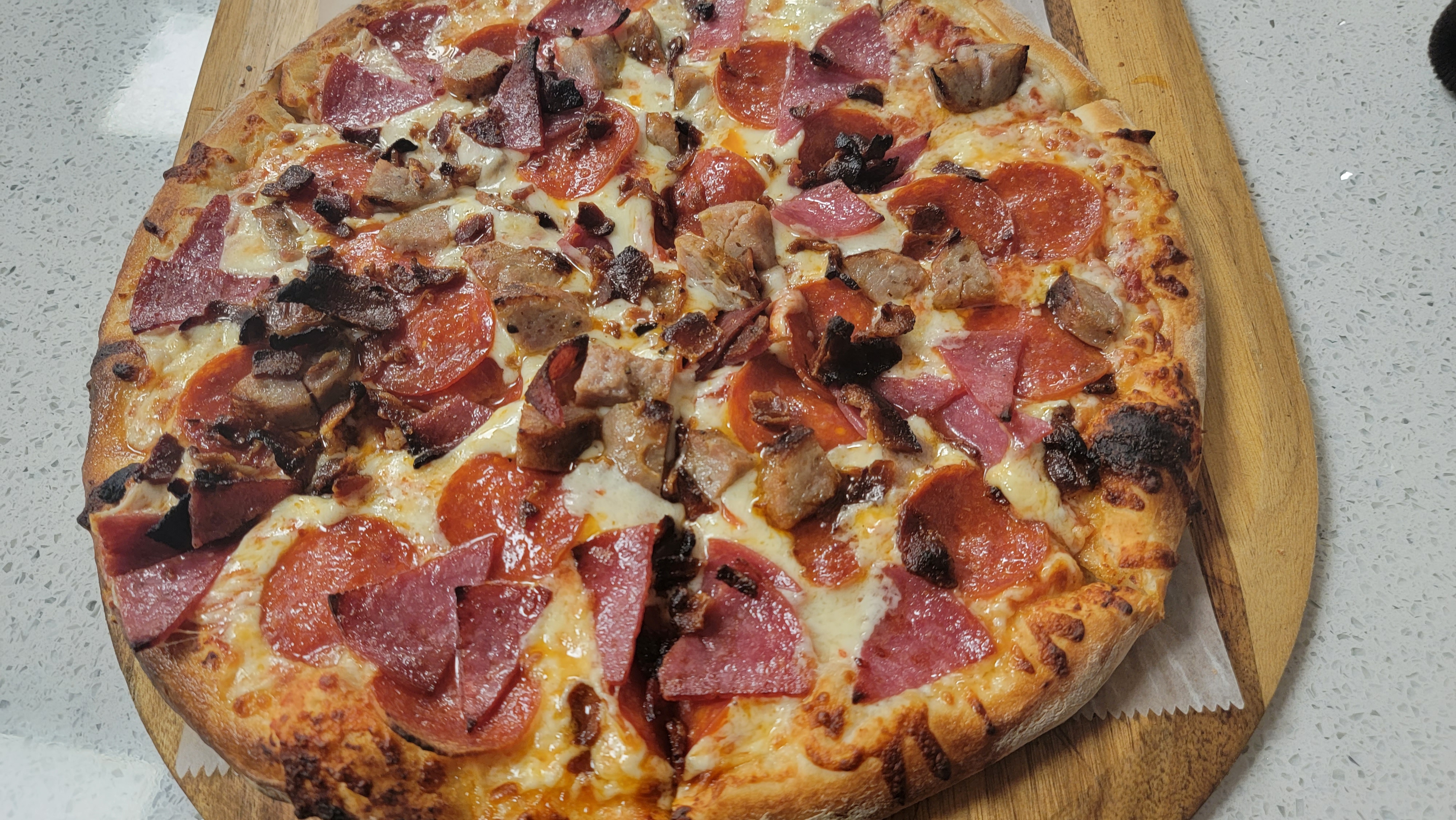 Order Meat Lovers Pizza food online from Bucci's Deli and Pizzeria store, Everett on bringmethat.com