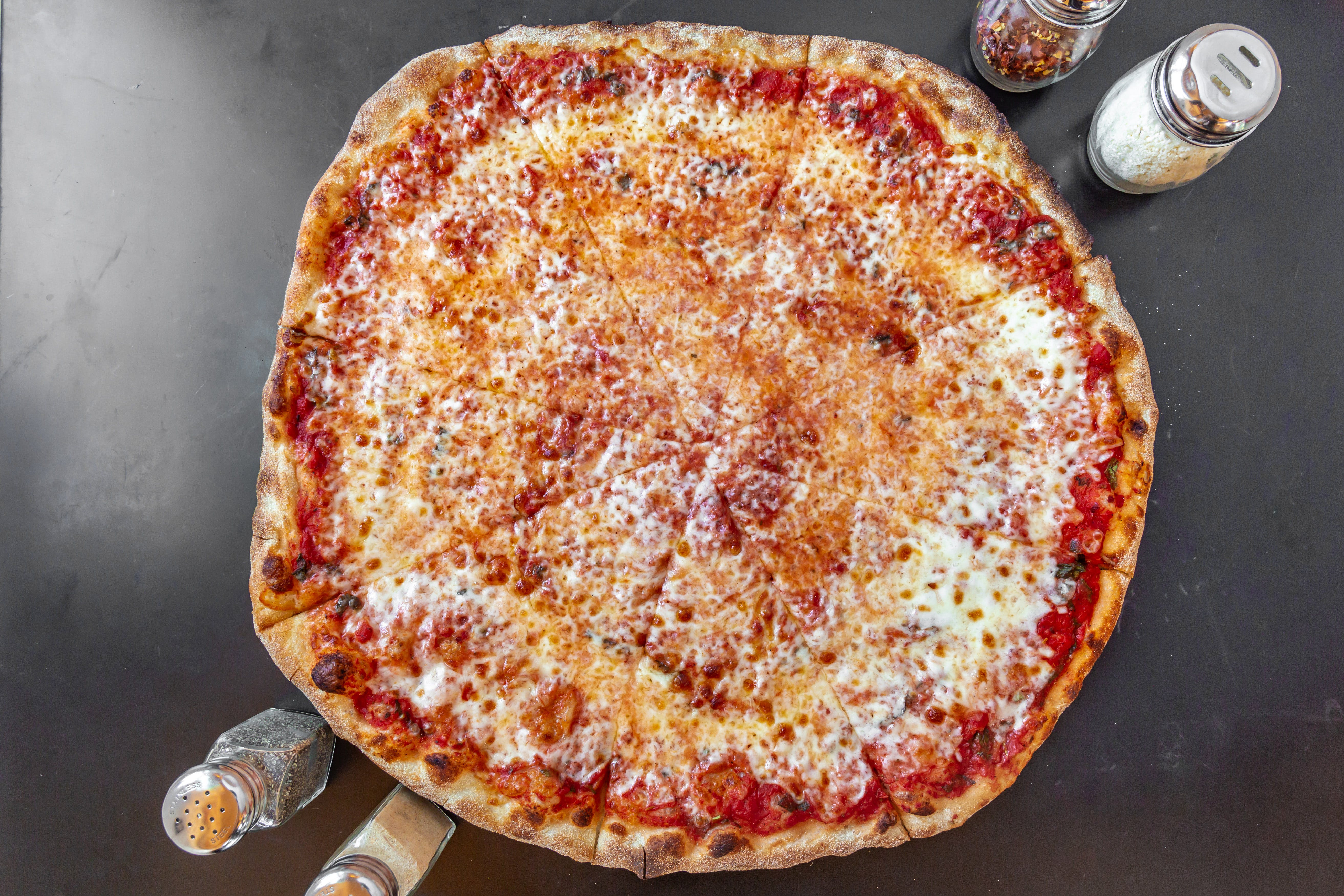 Order Traditional Cheese Pizza - Medium 14" feeds 2 food online from Pizza By Rocco store, Natick on bringmethat.com