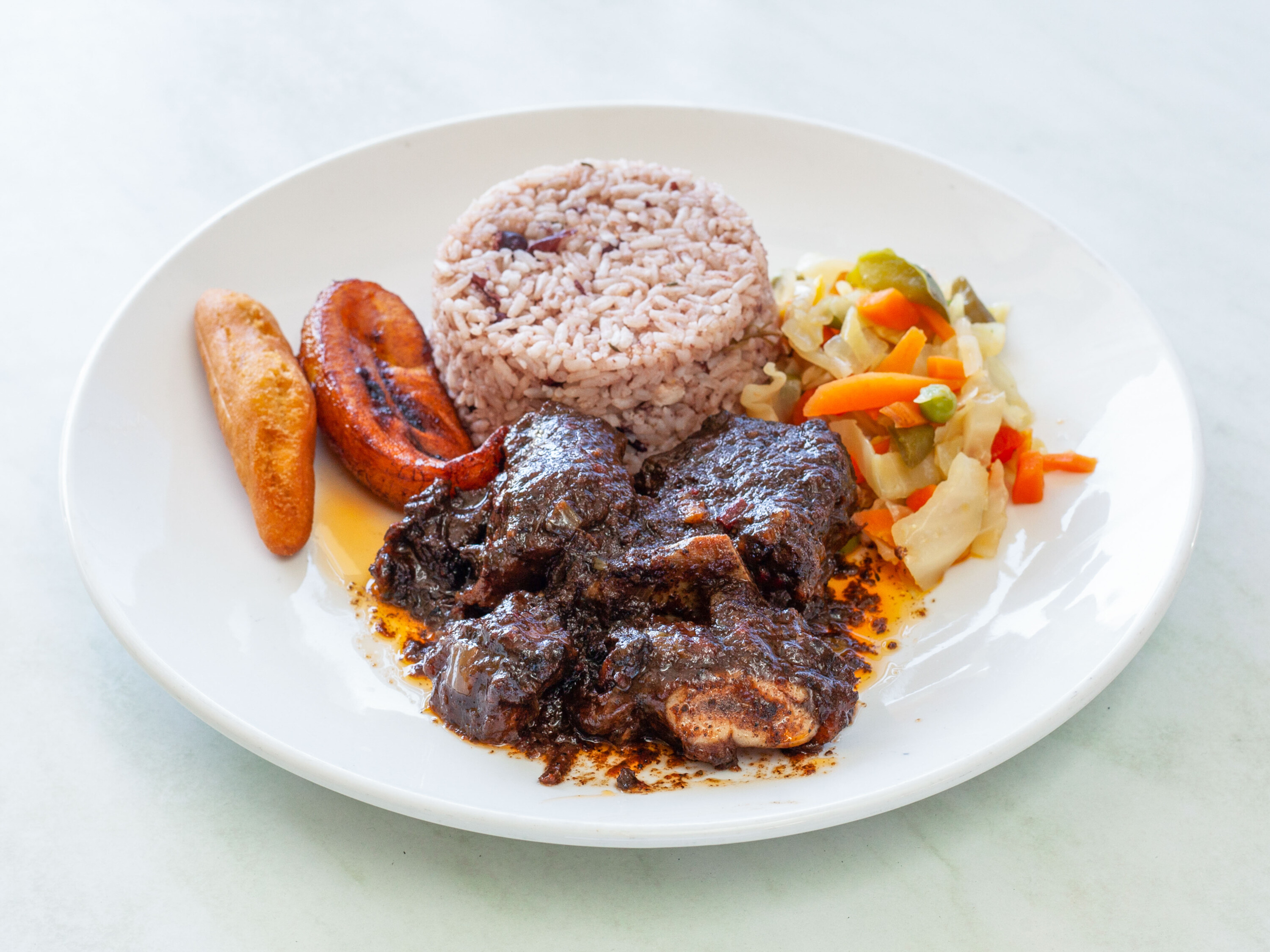 Order Short Ribs food online from One876 Caribbean Restaurant store, Chatsworth on bringmethat.com