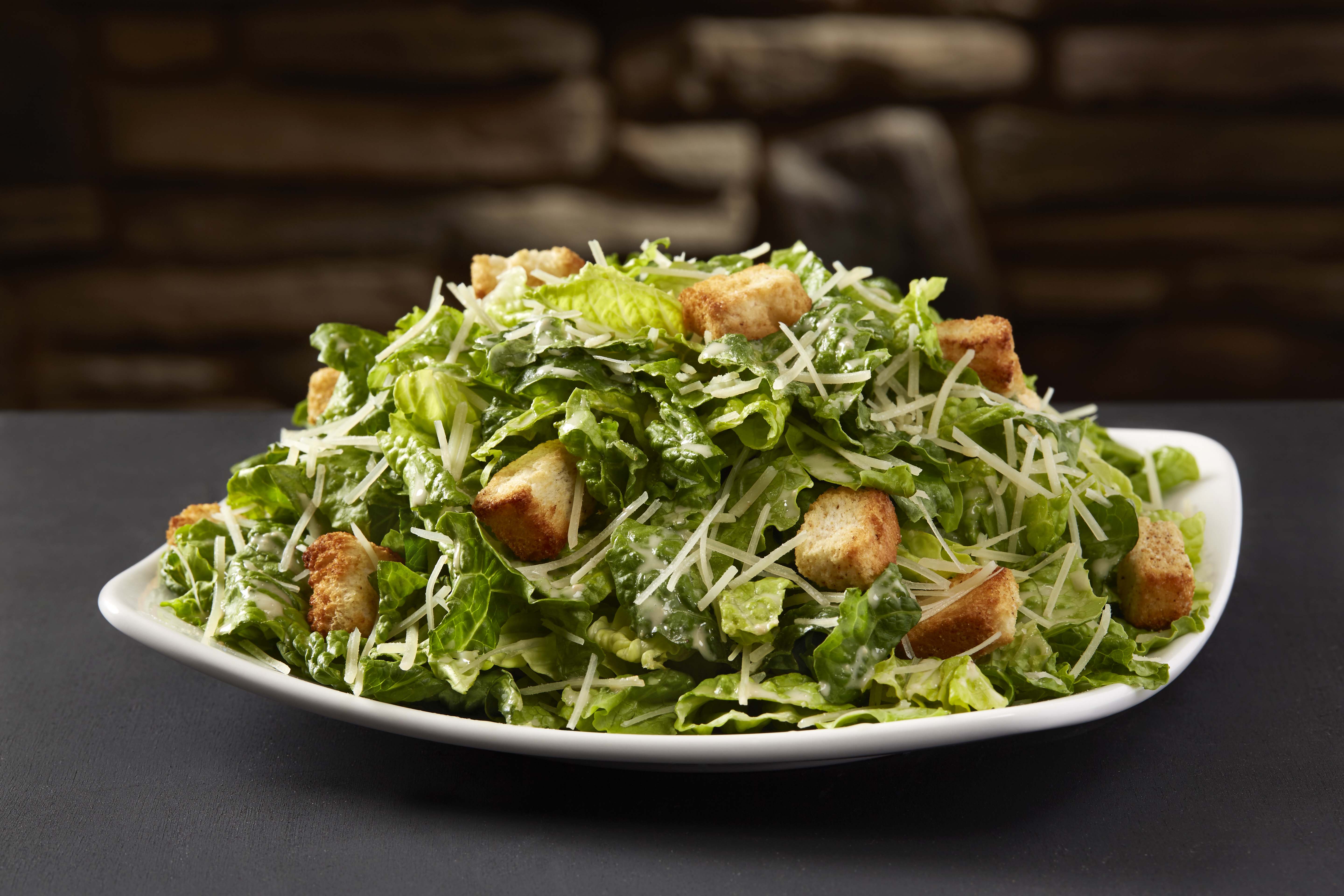 Order Caesar Side Salad food online from Sizzler store, Downey on bringmethat.com