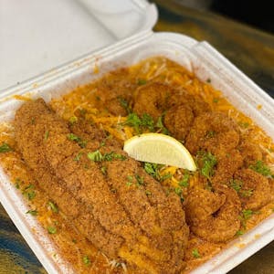 Order Cajun Fish and Gritz food online from Trap Fusion store, Cordova on bringmethat.com