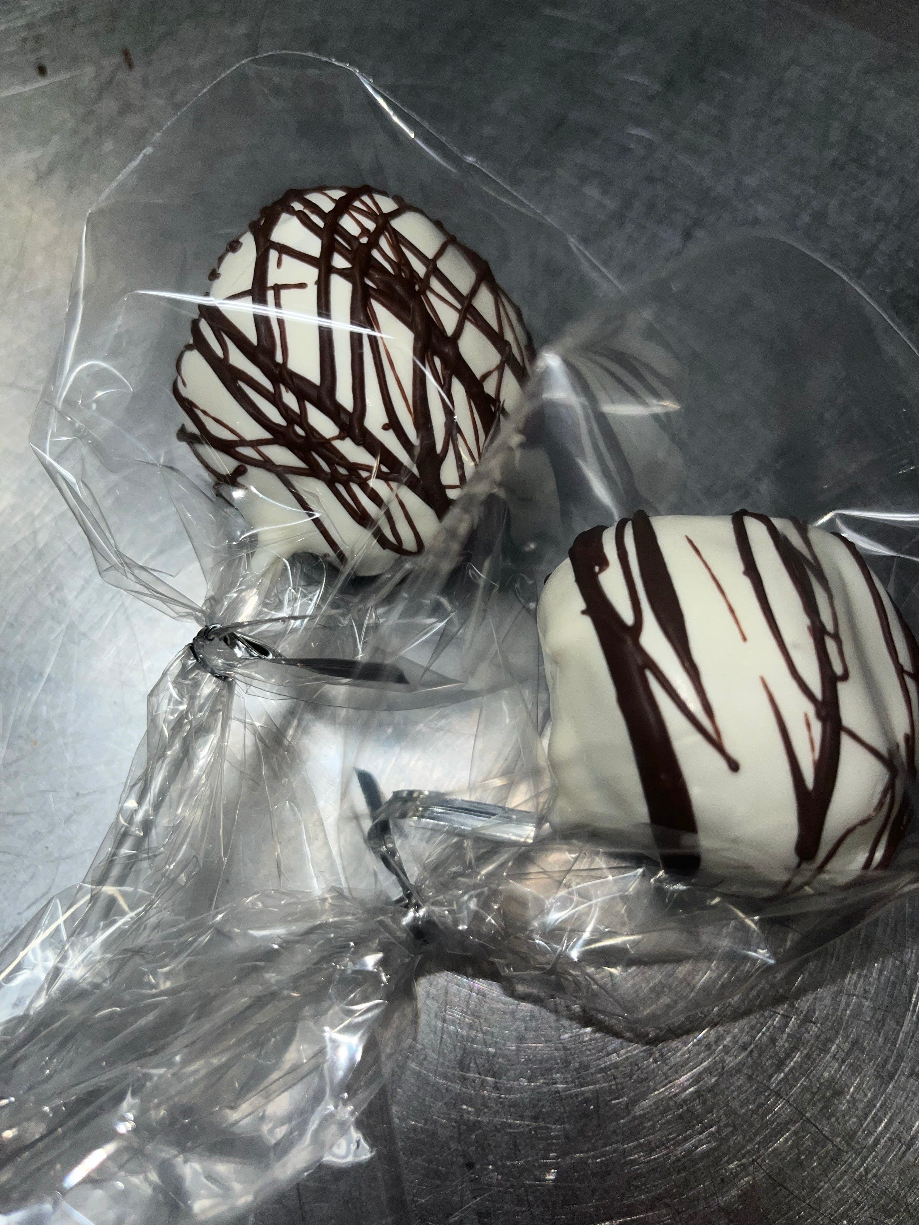 Order Vanilla and chocolate drizzle cake pop - one size food online from Woody's Pizza & Liquor - Boston store, Boston on bringmethat.com