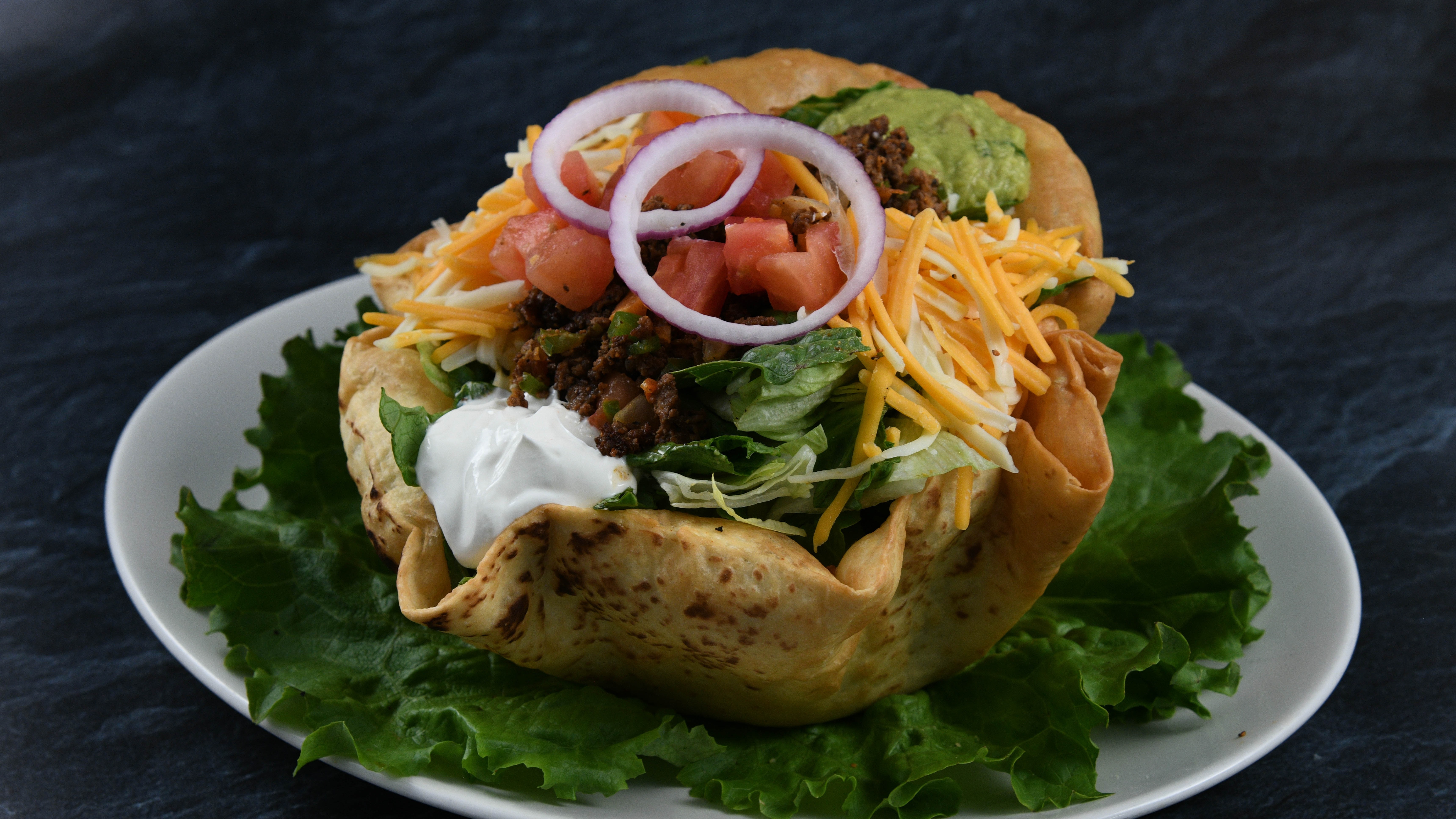 Order Taco Salad Beef food online from Rainforest Cafe store, Tempe on bringmethat.com