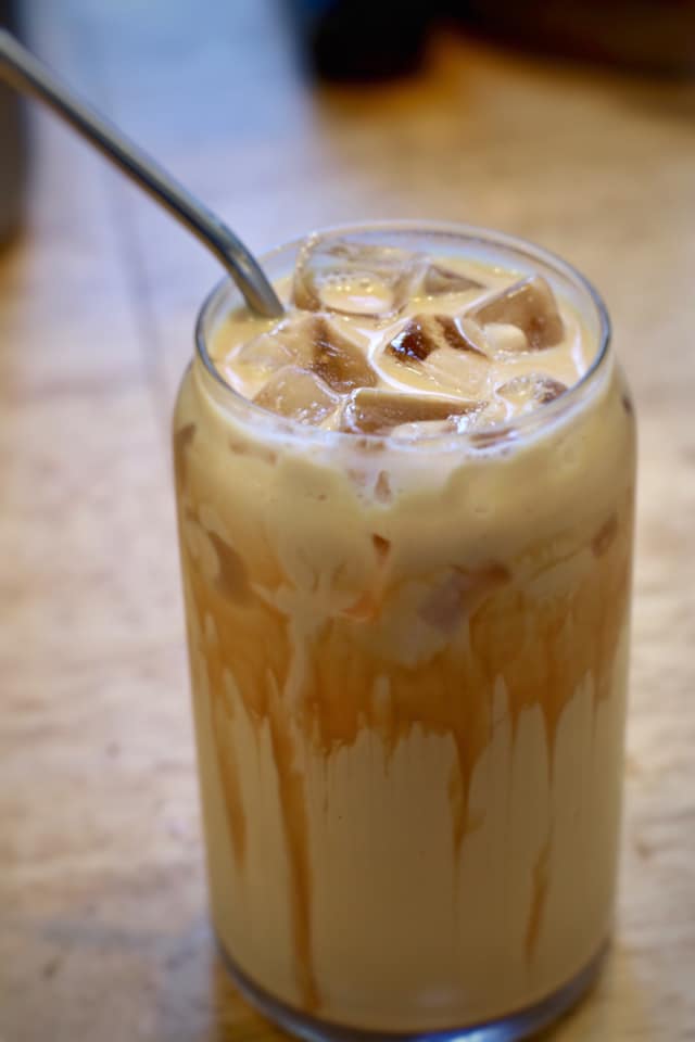 Order 16 oz. Iced Caramel Latte food online from CupLux Coffee Drive-Thru store, Charlotte on bringmethat.com