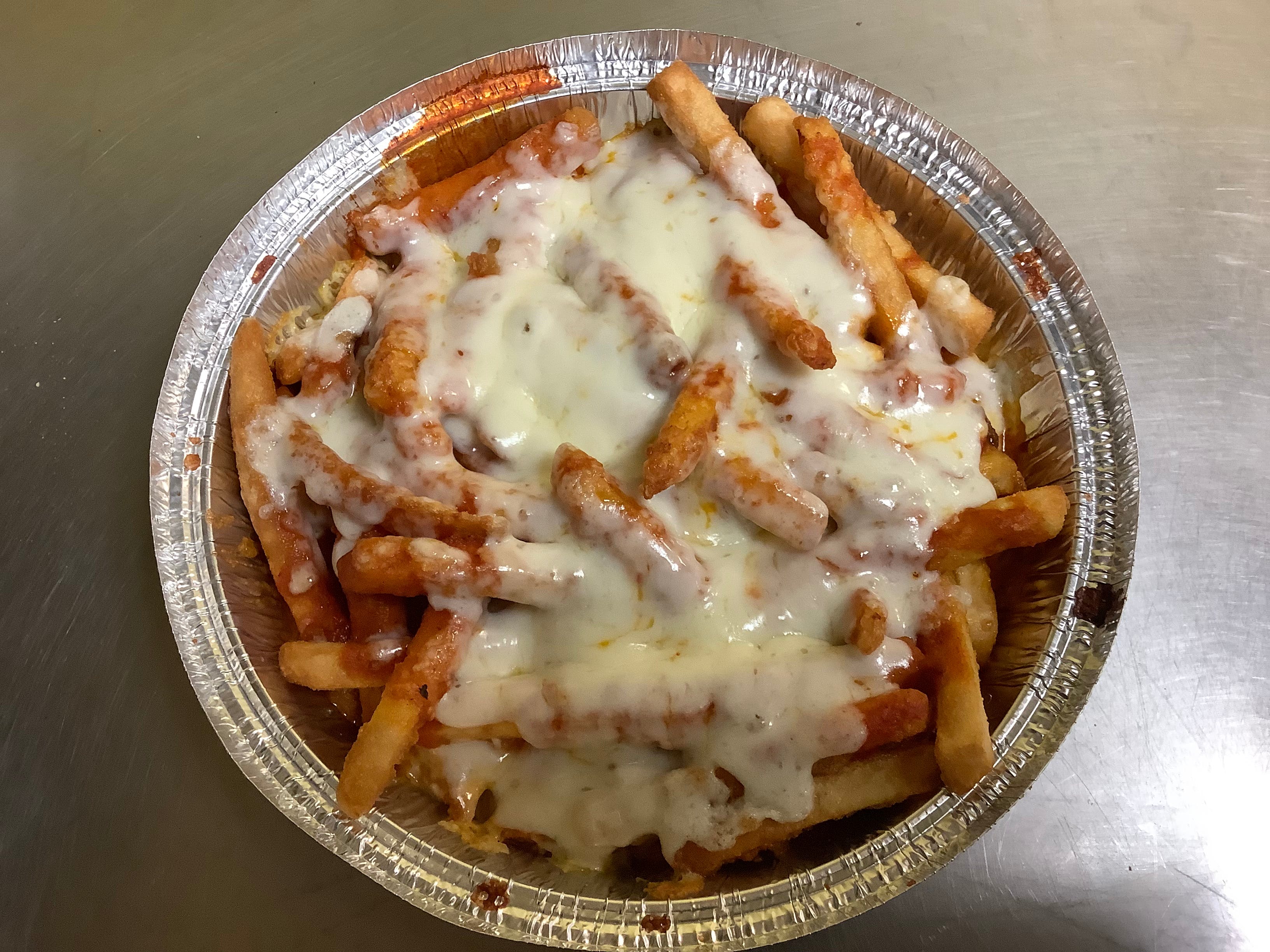 Order Pizza Fries - Side food online from Ginos Pizza store, Lindenwold on bringmethat.com