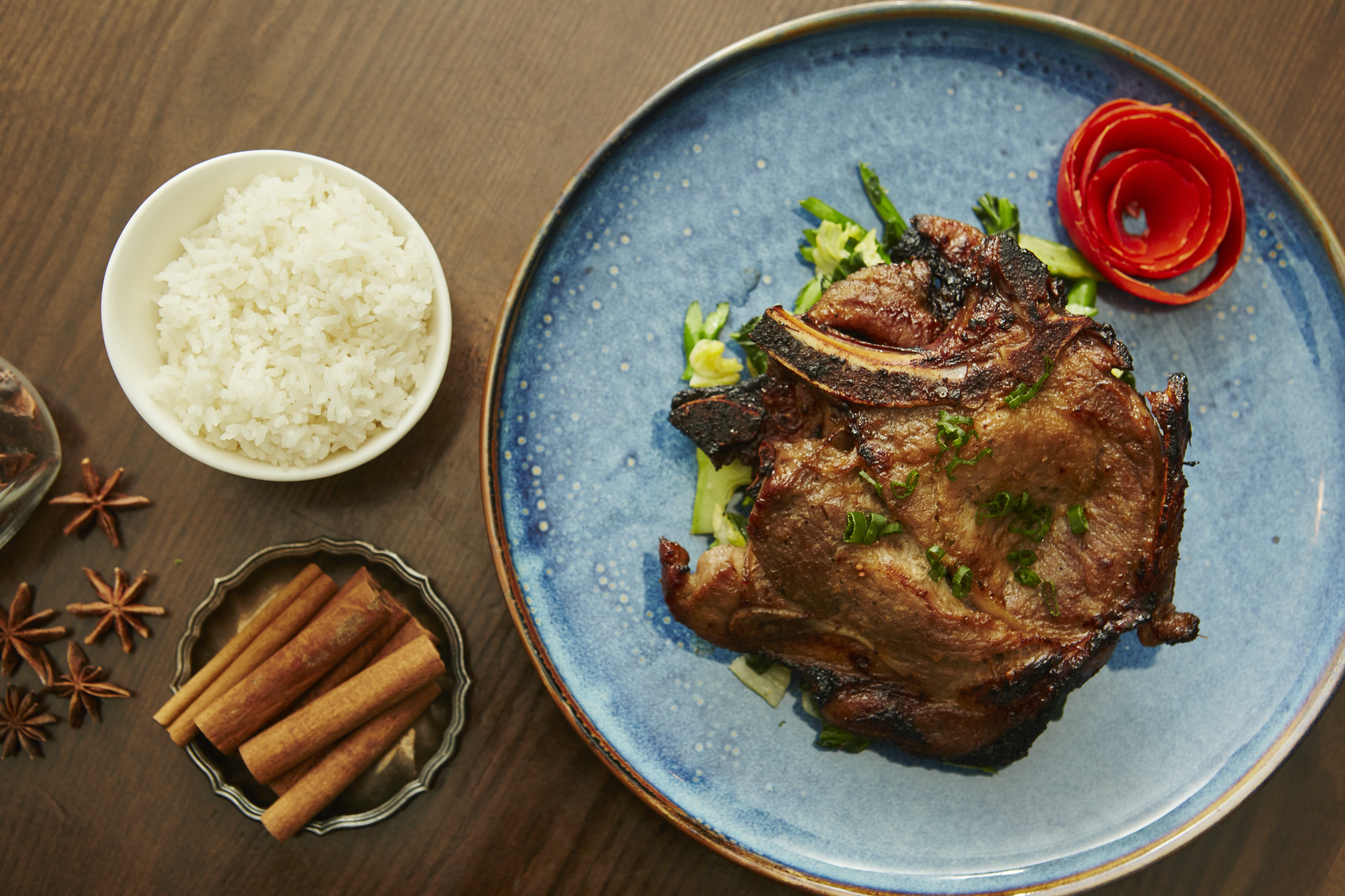 Order Meakong Aged Pork Chop food online from Yeti Spice Grill store, New York on bringmethat.com