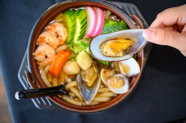 Order Seafood Udon Soup food online from Yummi Japanese Restaurant store, San Antonio on bringmethat.com