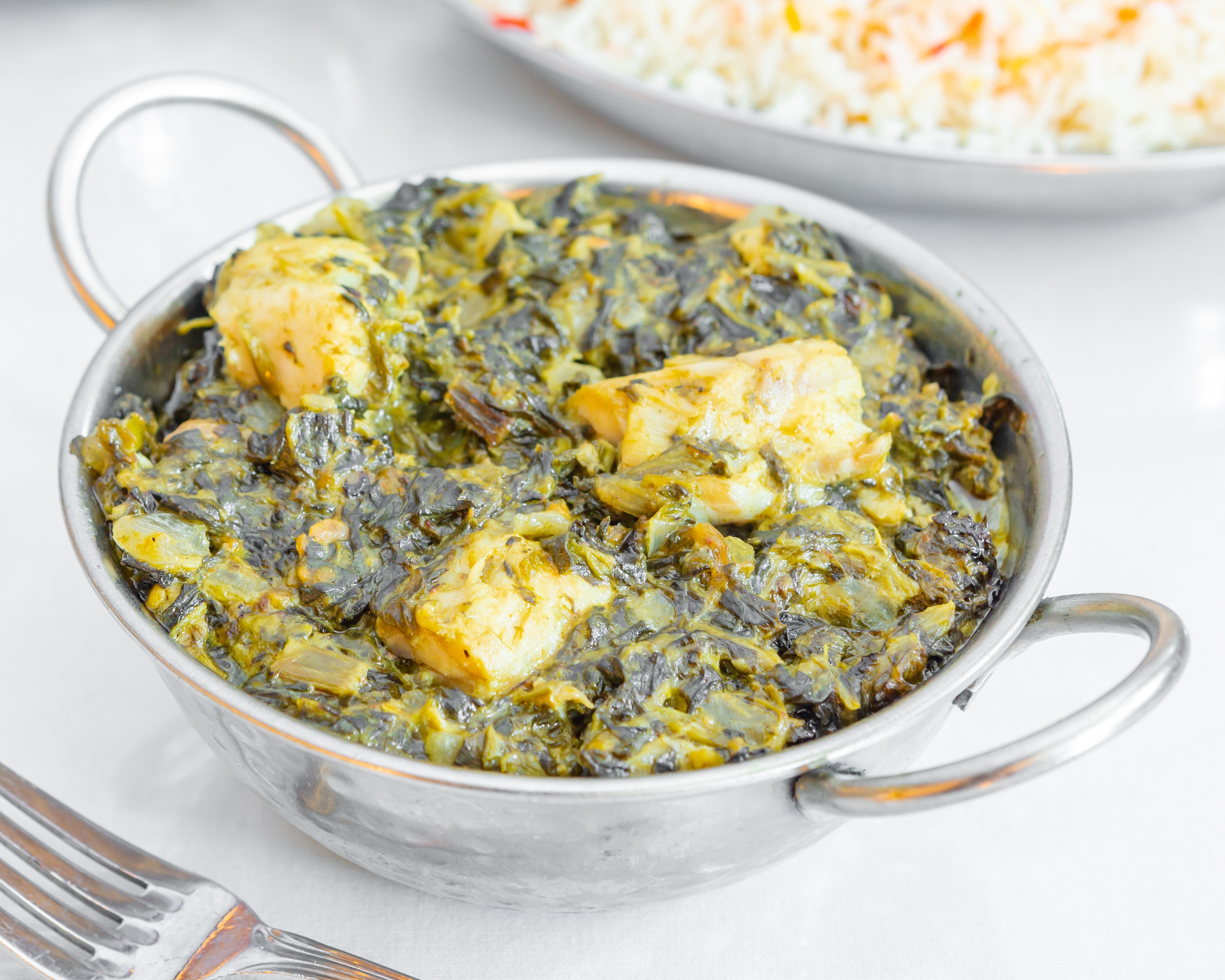 Order Fish Saag food online from India Quality Restaurant store, Boston on bringmethat.com