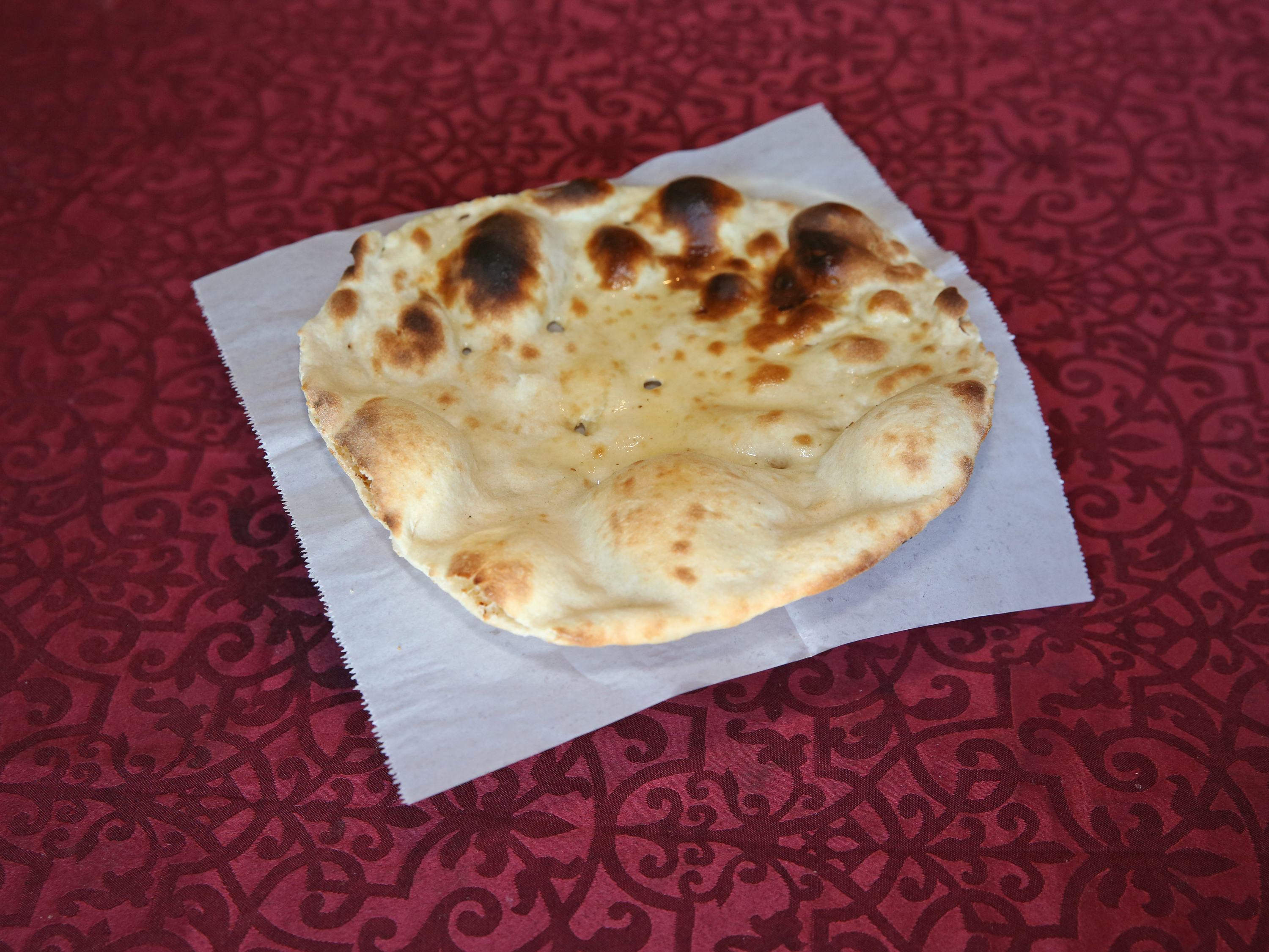 Order Naan food online from Cafe India store, Cedar Park on bringmethat.com