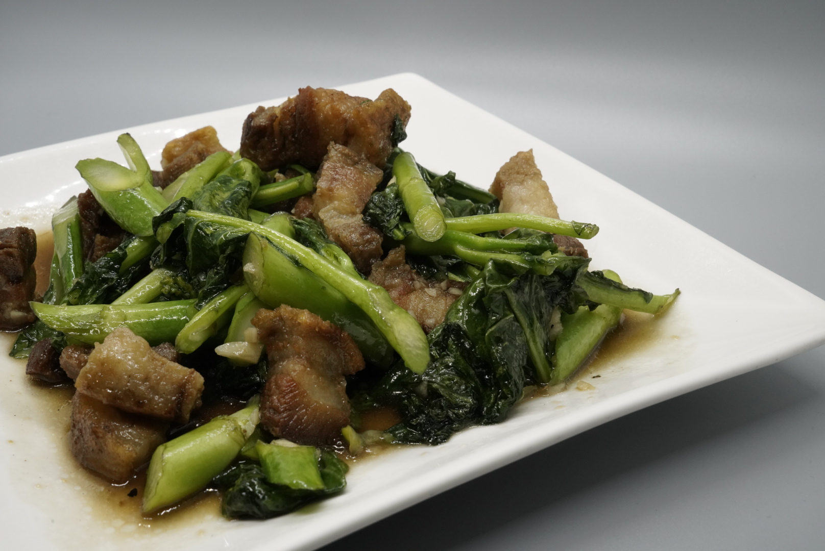 Order 47. Chinese Broccoli with Crispy Pork food online from Royal Orchid Thai Restaurant store, Riverside on bringmethat.com