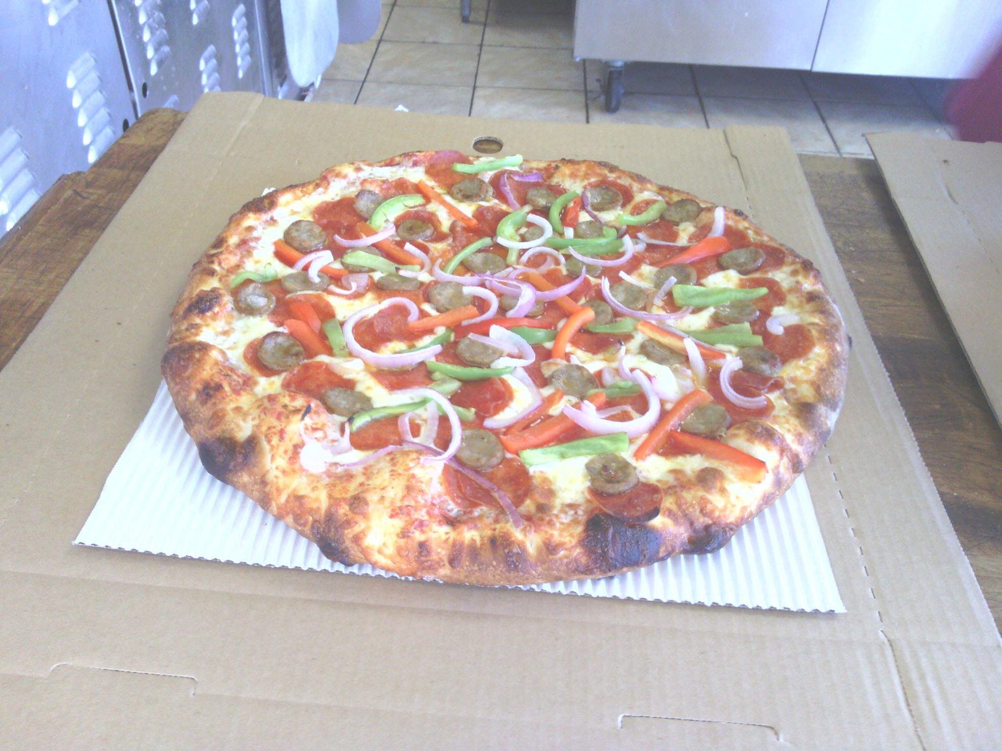 Order Supreme Pizza - Medium 12" (8 Slices) food online from The Pizza Place store, Riverside on bringmethat.com