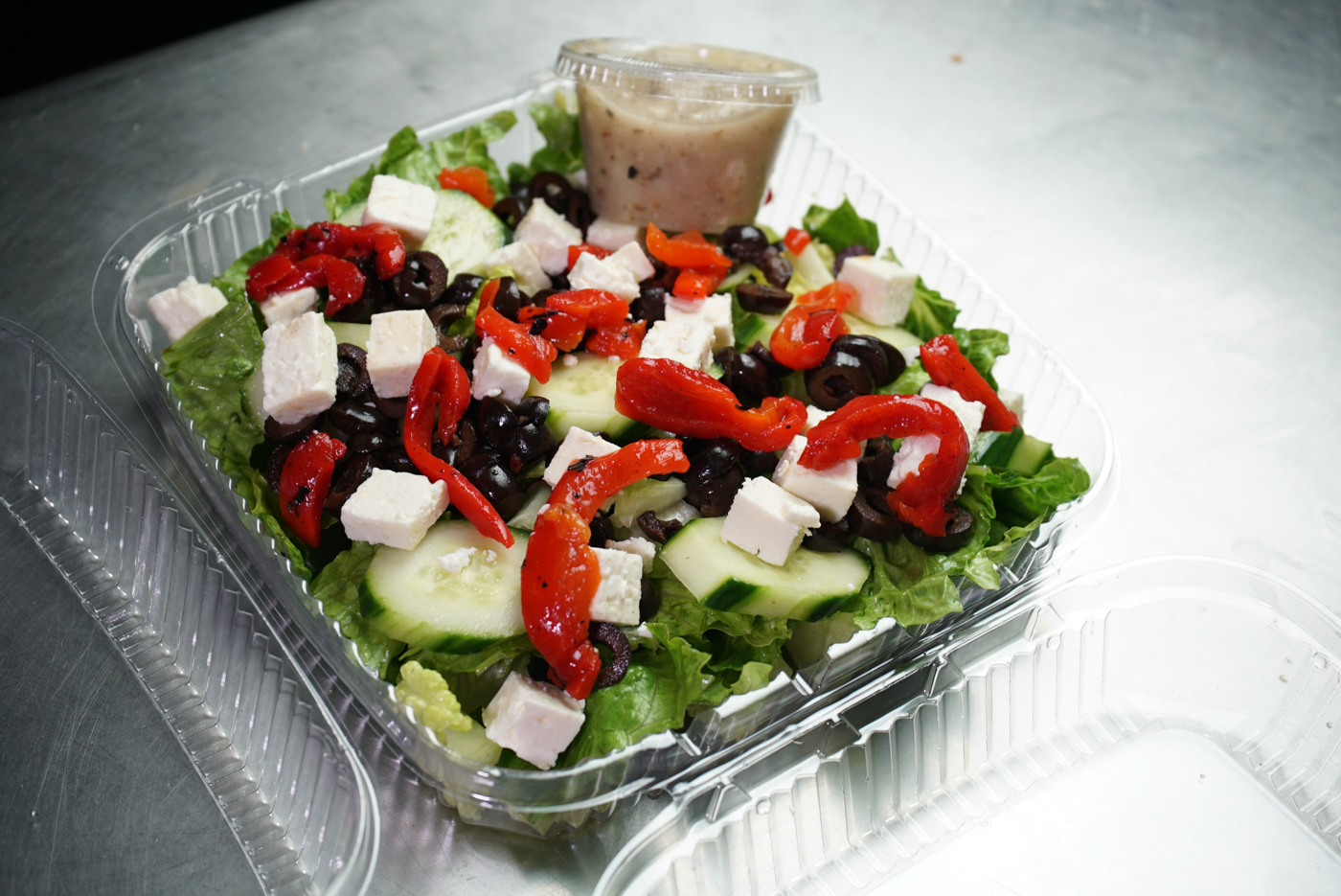 Order Greek Salad food online from Madison's Pizza store, Albany on bringmethat.com