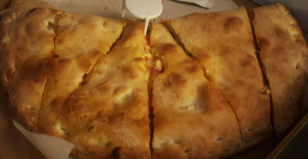 Order 12. Mozzarella, Ricotta and Spinach Calzone food online from Mr. Pizza Man store, Daly City on bringmethat.com
