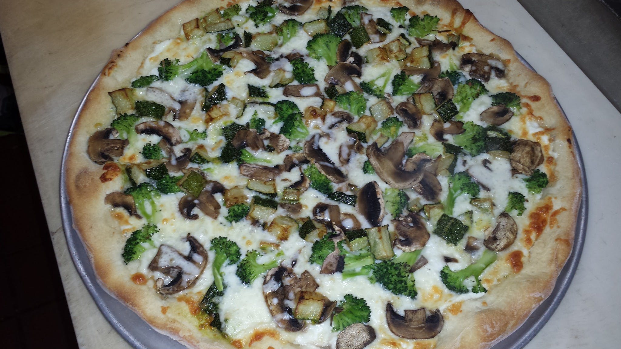 Order White Pizza - Small 12" food online from Rino's Italian Grill & Pizza store, Creedmoor on bringmethat.com