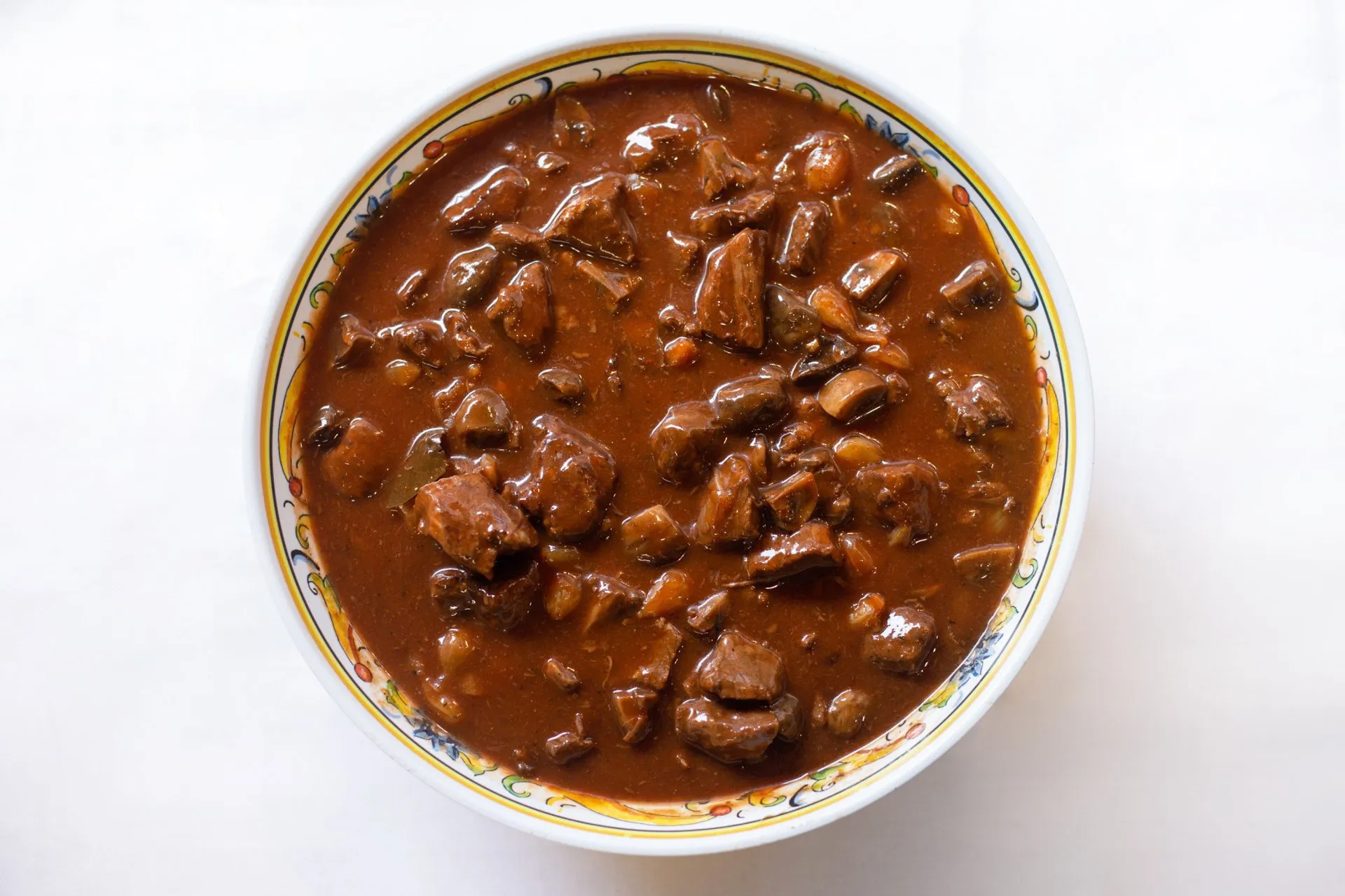 Order 1/2 lb. Beef Bourguignon  food online from Food Passion Cafe store, New York on bringmethat.com
